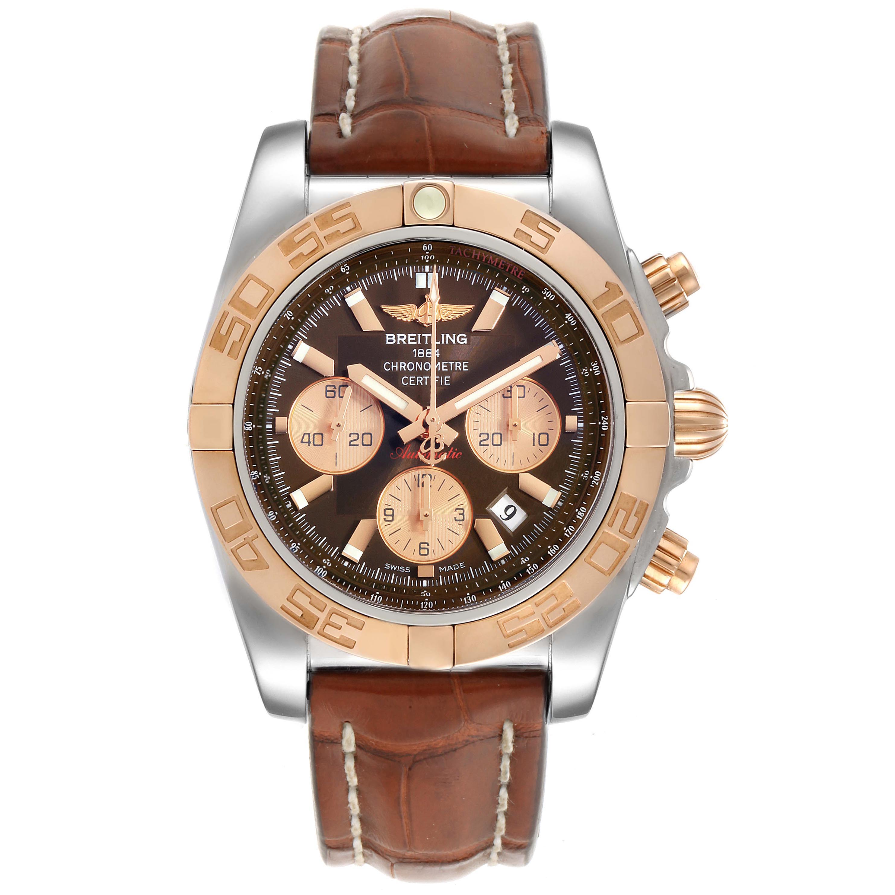 The image shows a front view of a Breitling Chronomat CB0110 Men
s Steel and Gold (two tone) Brown Dial CB0110 Men
s Steel and Gold (two tone) Brown Dial watch with a leather strap, gold bezel, and multiple chronograph dials.