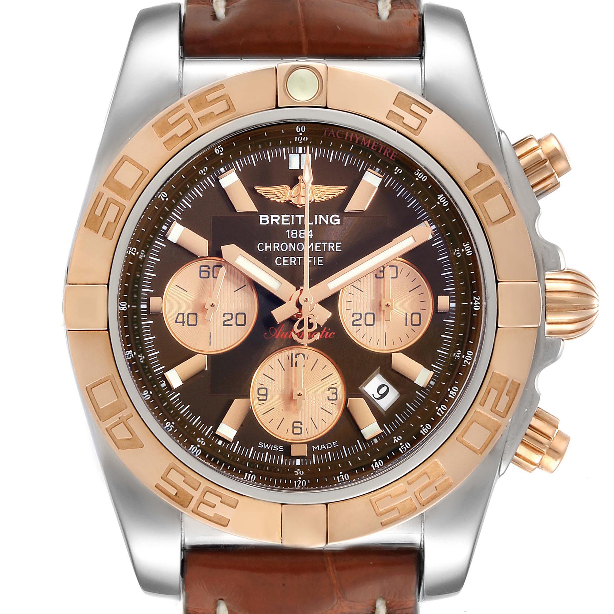 This Breitling Chronomat CB0110 Men
s Steel and Gold (two tone) Brown Dial CB0110 Men
s Steel and Gold (two tone) Brown Dial watch is shown from a front angle, featuring its dial, bezel, sub-dials, hands, and part of the leather strap.