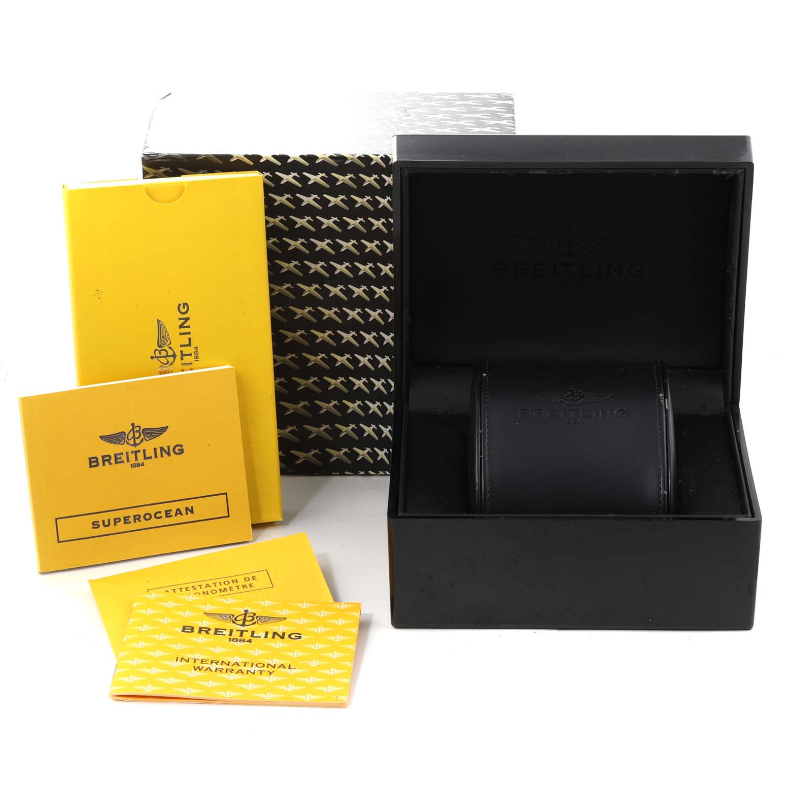 The image shows a Breitling Superocean A17364 Men's Stainless Steel Black Dial A17364 Men's Stainless Steel Black Dial watch box, with accompanying manuals and warranty cards.