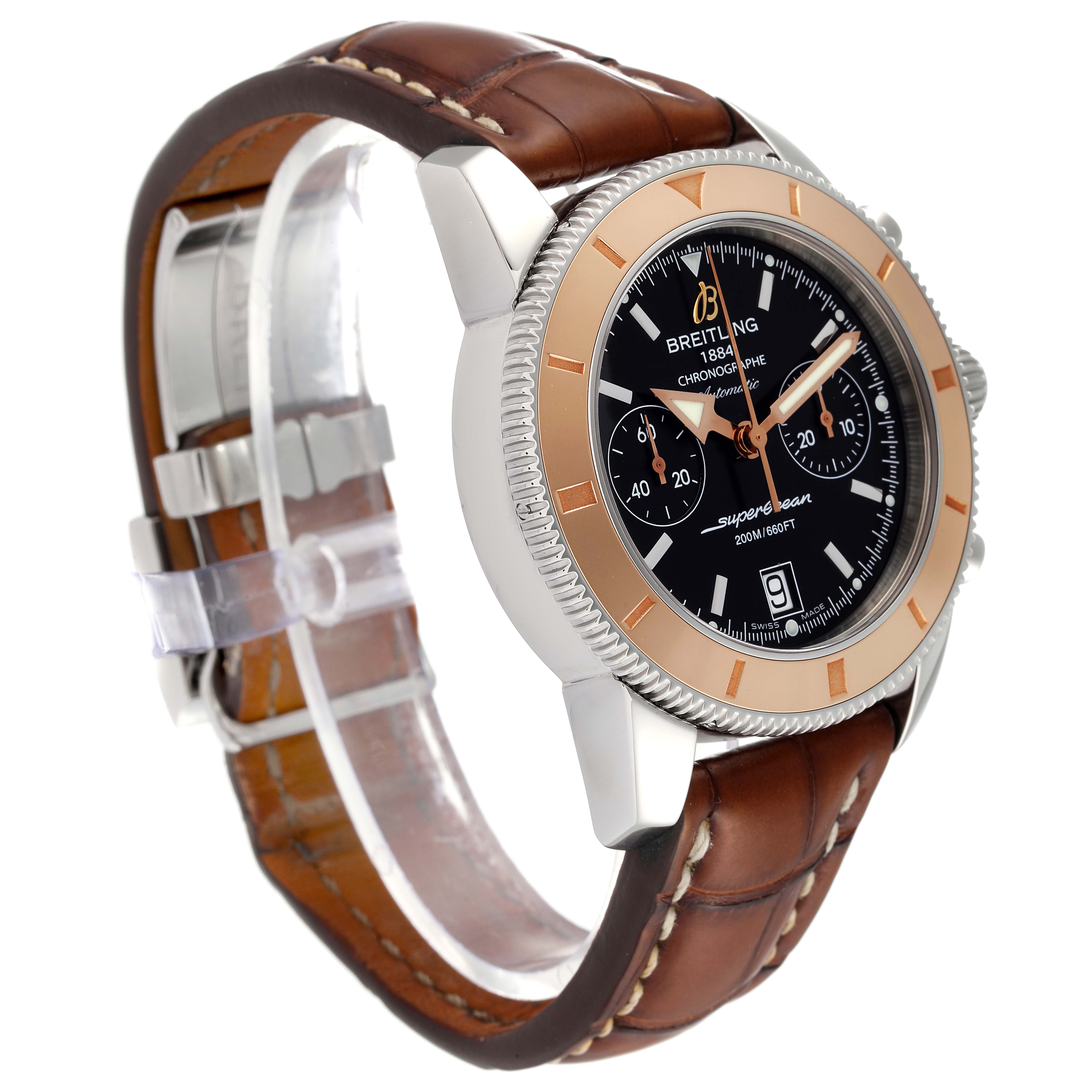 The Breitling Superocean U23370 Men's Steel and Gold (two tone) Black Dial U23370 Men's Steel and Gold (two tone) Black Dial model watch is shown at a slight angle, highlighting its face, bezel, case, and brown leather strap.