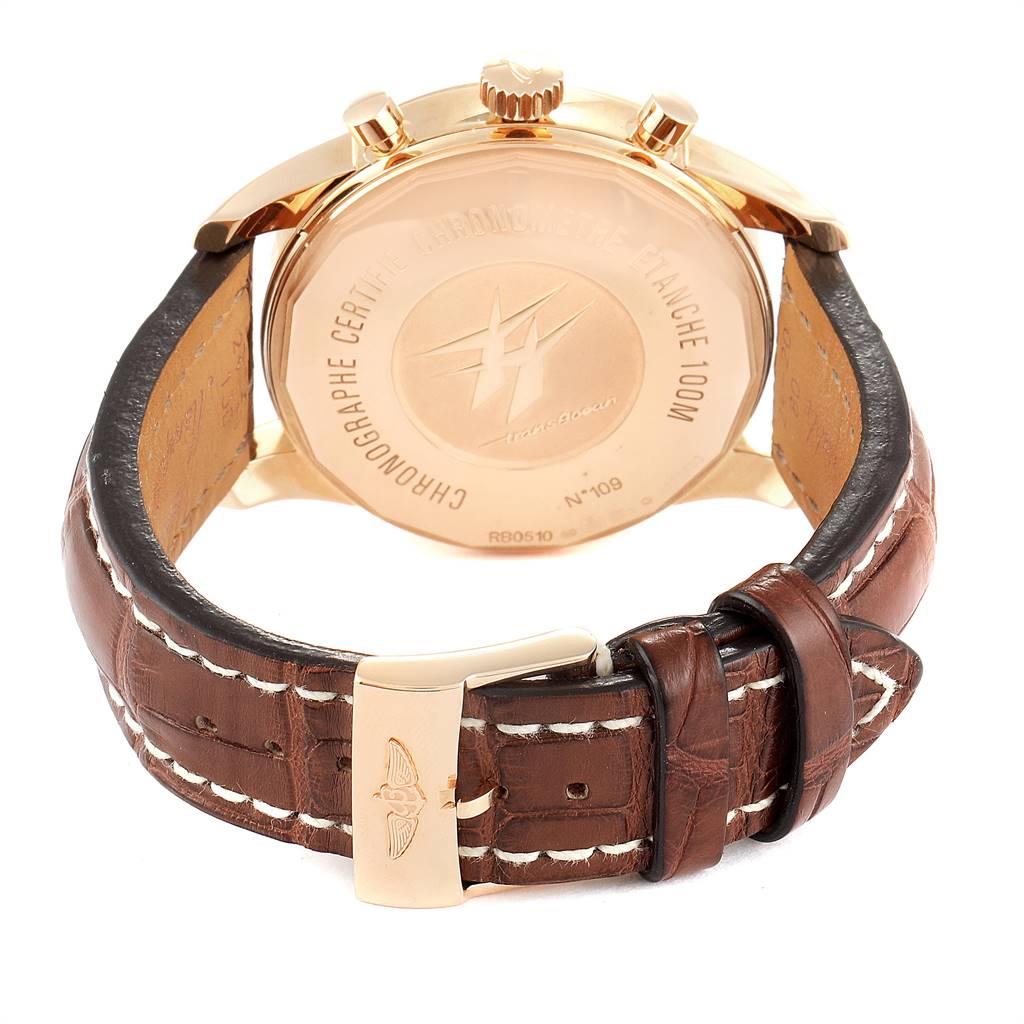 The image shows the back and strap of a Breitling Transocean RB0510U4-BB63BKLD Men
s Rose Gold Black Dial RB0510U4-BB63BKLD Men
s Rose Gold Black Dial watch, highlighting the case back, crown, pushers, and leather strap with stitching.