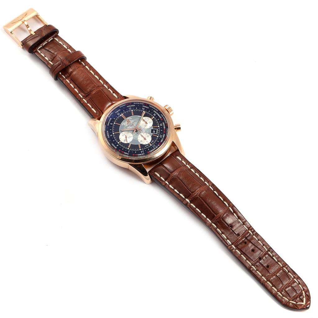 This image displays a Breitling Transocean RB0510U4-BB63BKLD Men
s Rose Gold Black Dial RB0510U4-BB63BKLD Men
s Rose Gold Black Dial watch from a top-down angle, showcasing the dial, case, and leather strap.