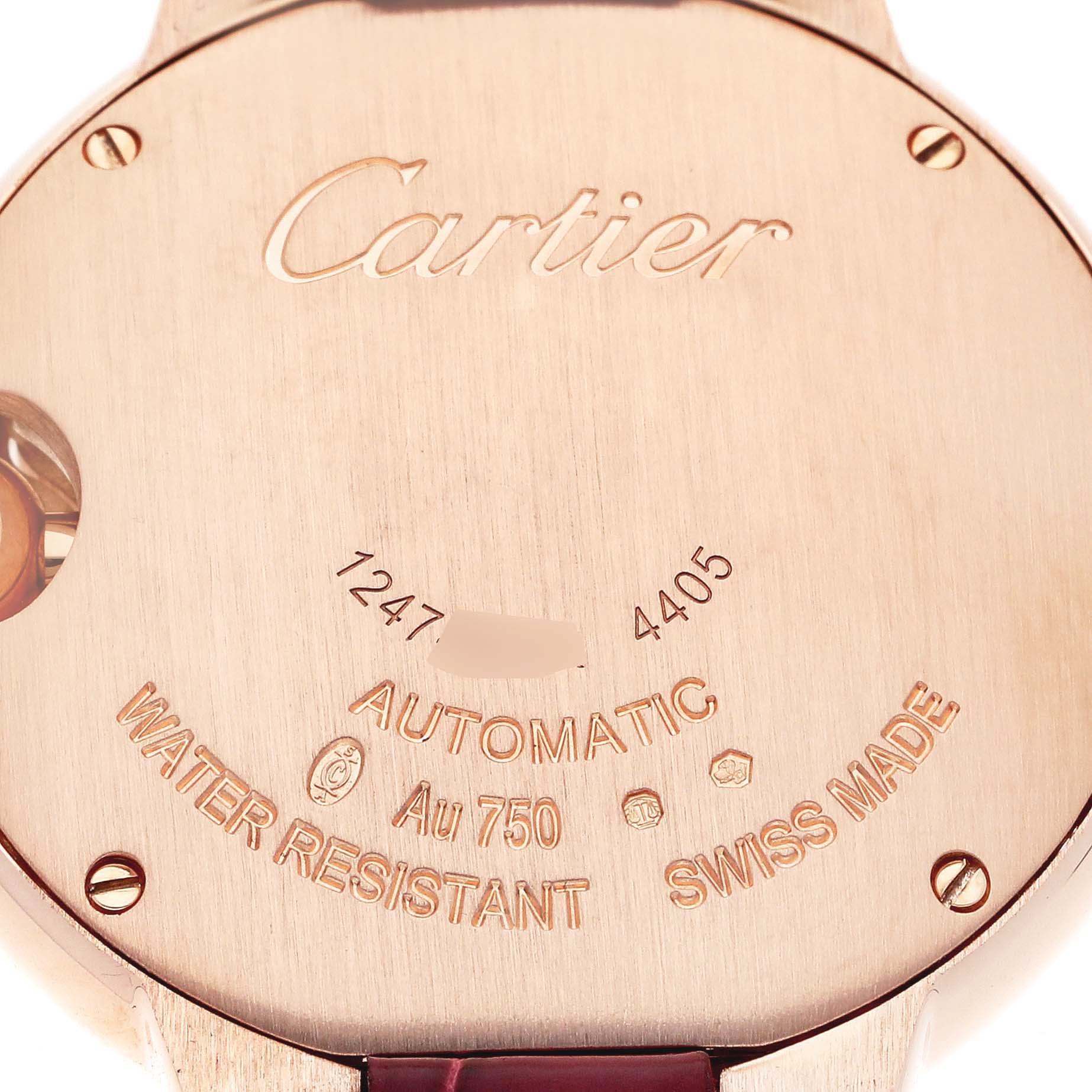 The image shows the back case of a Cartier Ballon Bleu WJBB0033 Women's Rose Gold Silver Dial watch, highlighting the brand, model, and specifications.