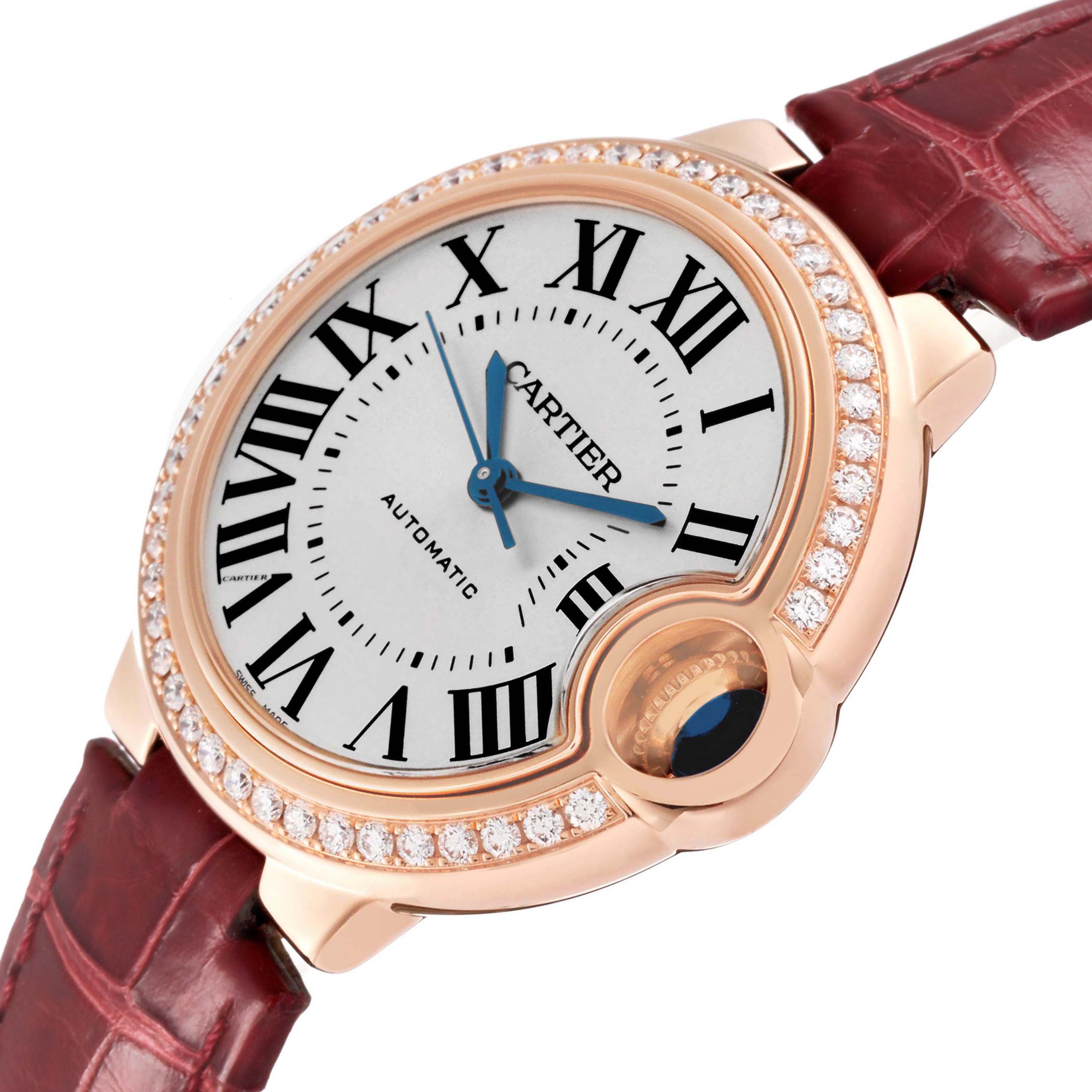 The Cartier Ballon Bleu WJBB0033 Women's Rose Gold Silver Dial watch is shown at an angled view, highlighting the face, Roman numerals, diamond bezel, and crown detail.