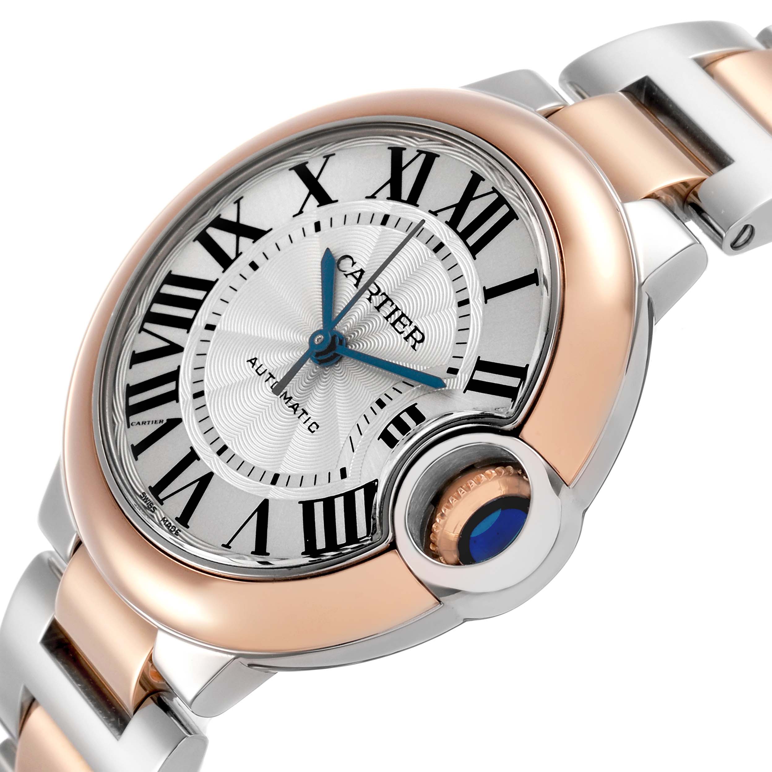 The Cartier Ballon Bleu W2BB0023 Women's Steel and Gold (two tone) Silver Dial watch is shown at an angled view, highlighting its dial, Roman numerals, and crown with blue cabochon.