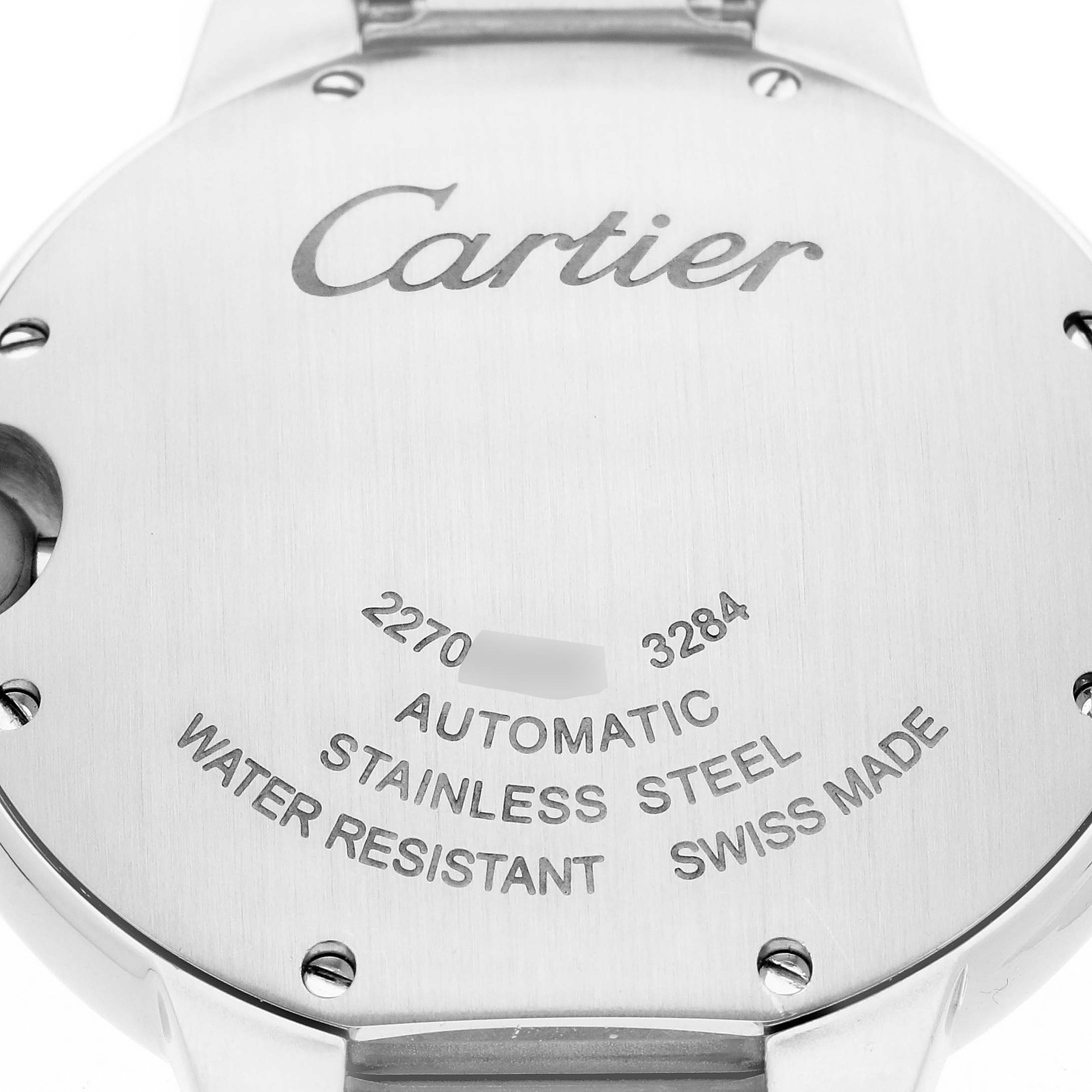 The image shows the stainless steel back of a Cartier Ballon Bleu W69017Z4 Men
s Stainless Steel Silver Dial W69017Z4 Men
s Stainless Steel Silver Dial watch, displaying engravings and screw details.