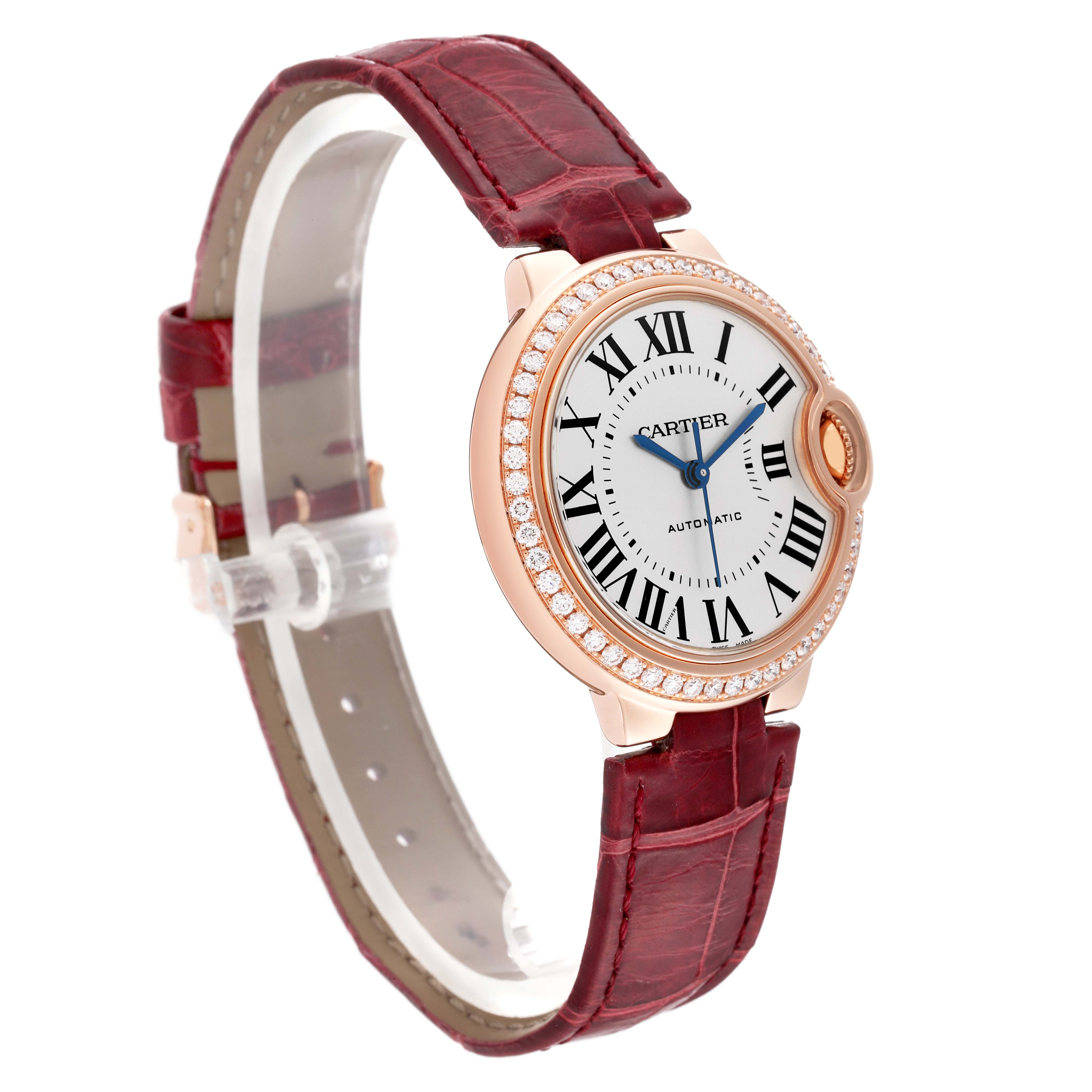The image shows a Cartier Ballon Bleu WJBB0033 Women's Rose Gold Silver Dial WJBB0033 Women's Rose Gold Silver Dial watch at a slight angle, highlighting its face, red leather strap, and diamond-encrusted bezel.