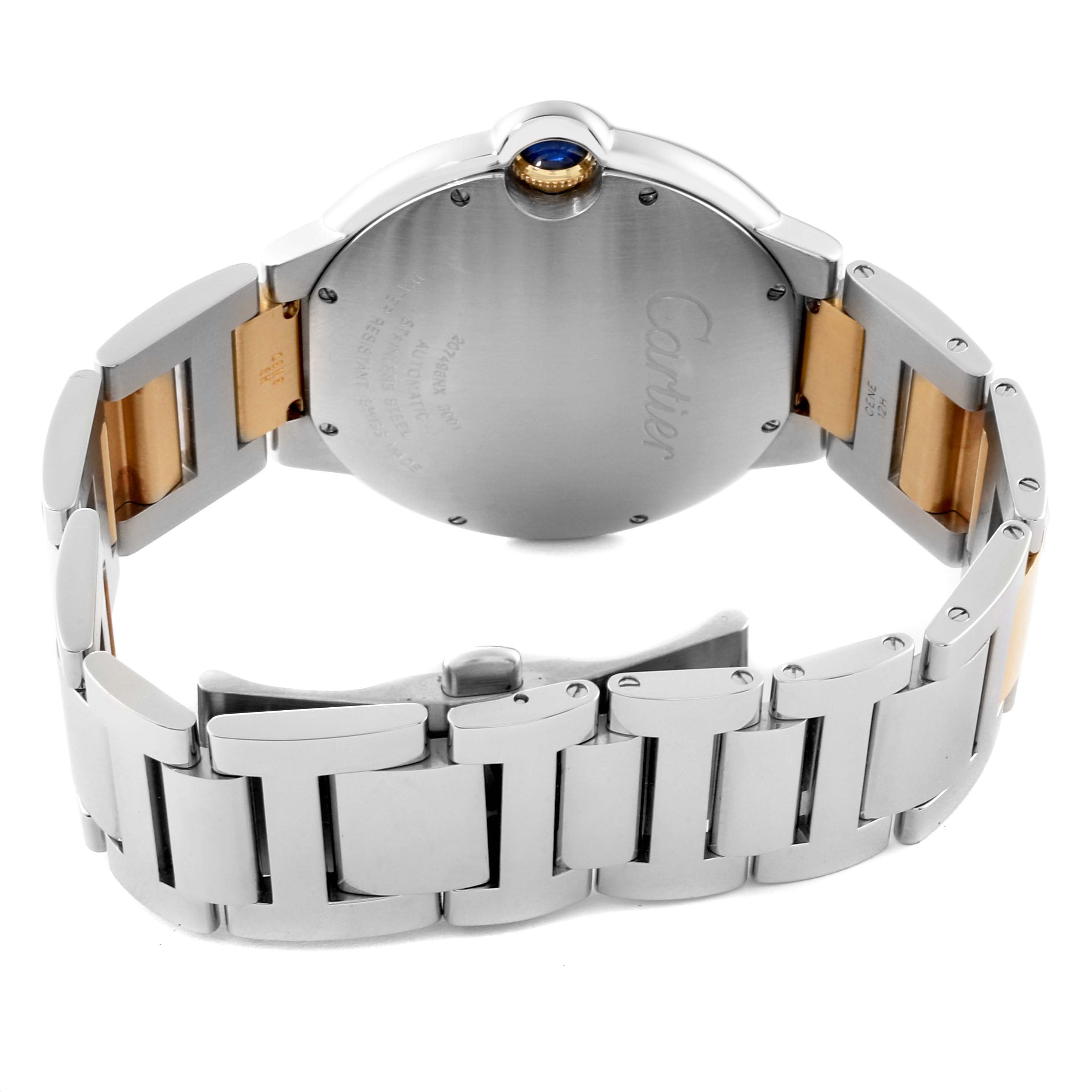 The image shows the back case and bracelet of a Cartier Ballon Bleu W69009Z3 Men's Steel and Gold (two tone) Silver Dial W69009Z3 Men's Steel and Gold (two tone) Silver Dial watch, highlighting its two-tone design and sapphire crown.