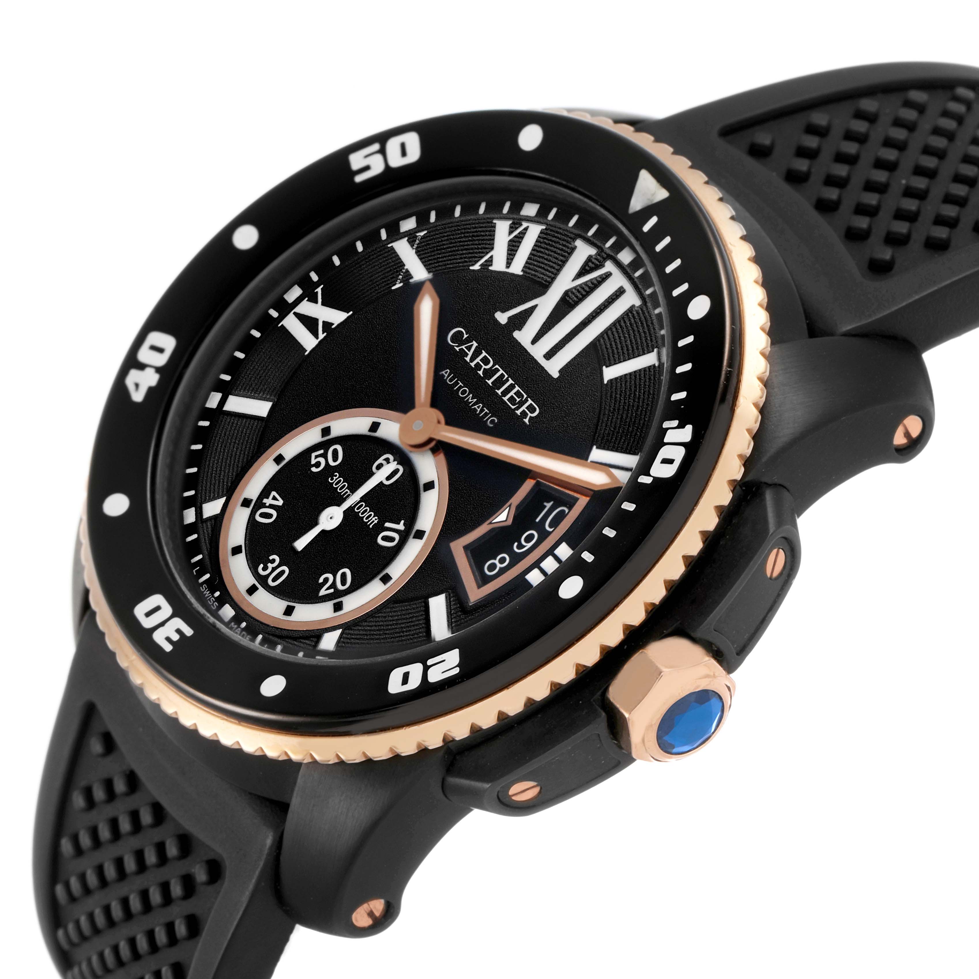 The Calibre de Cartier watch is shown at an angle highlighting the dial, bezel, crown, and strap.