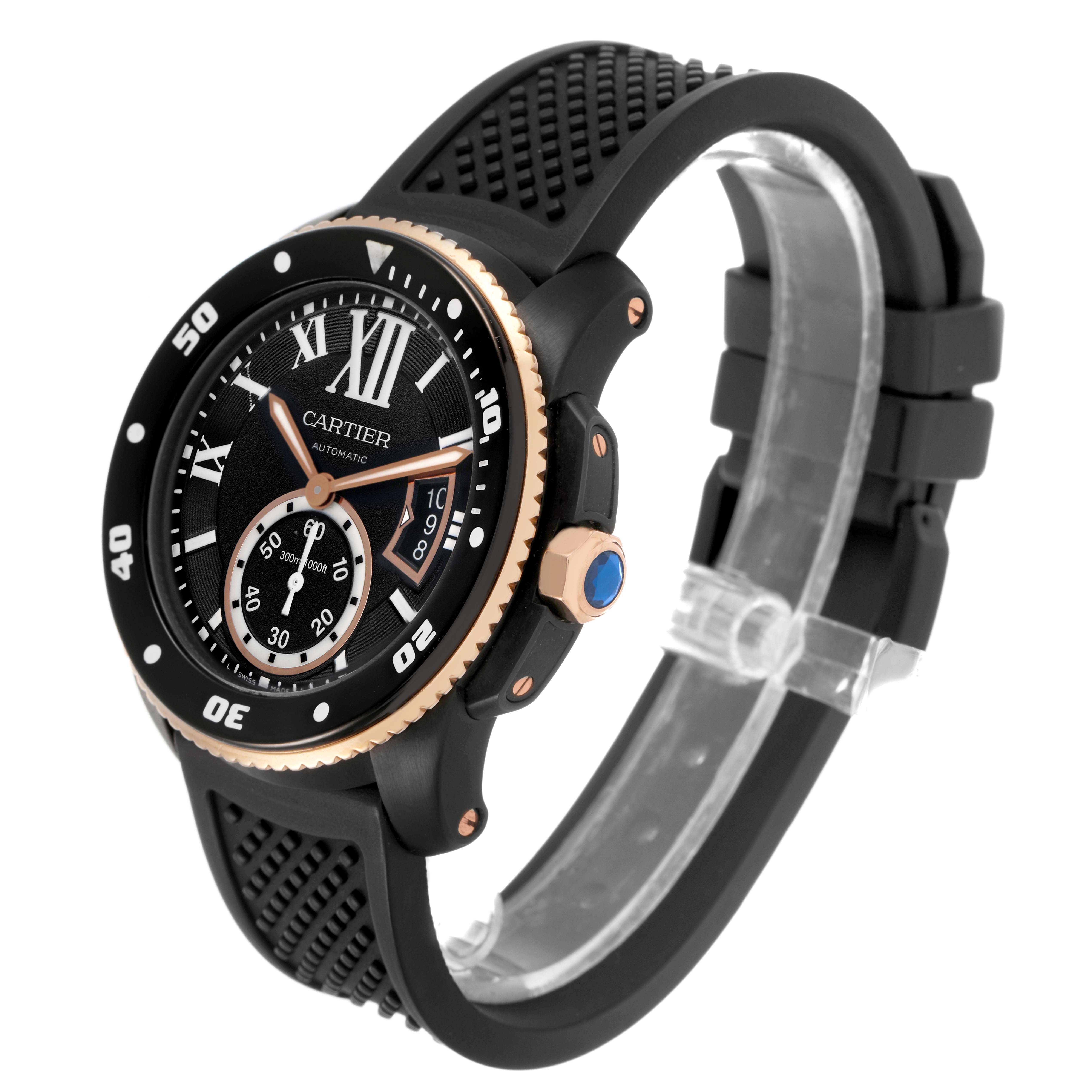 The Calibre de Cartier watch is shown at a slight angle, highlighting its face, bezel, crown, and rubber strap.