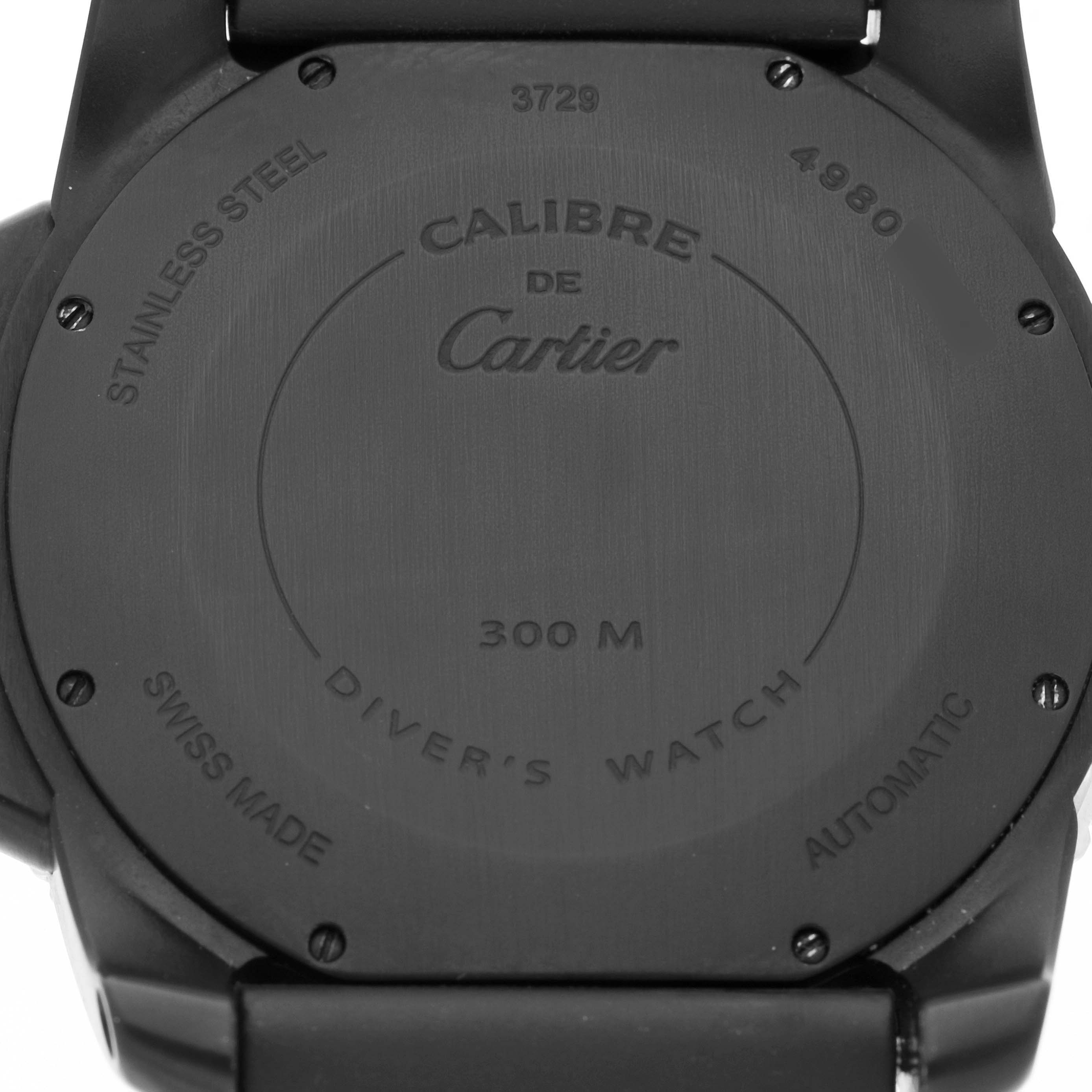 The image shows the back case of a Calibre de Cartier watch, highlighting its markings and details.