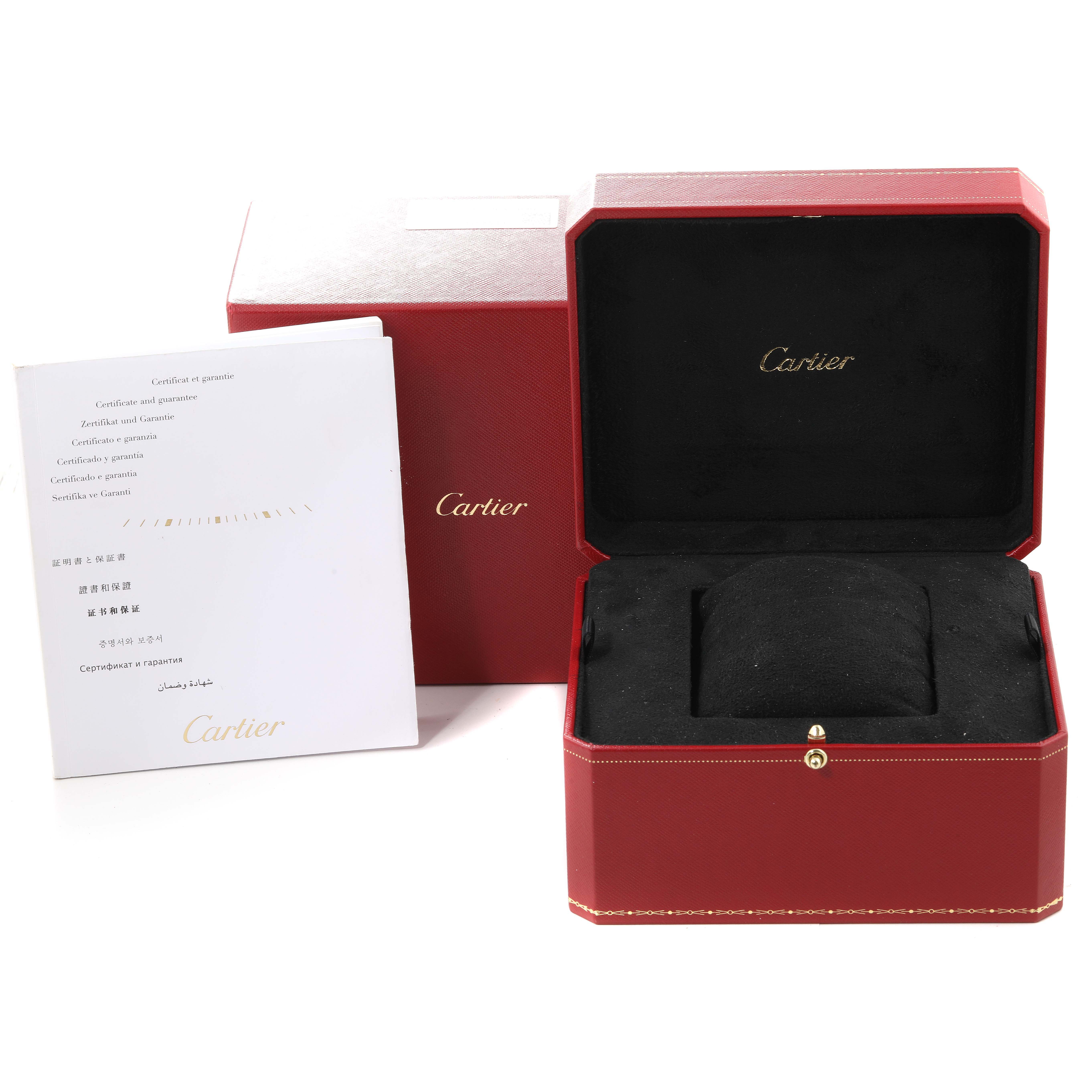 The image shows a Calibre de Cartier watch box by Cartier along with accompanying documents and packaging.