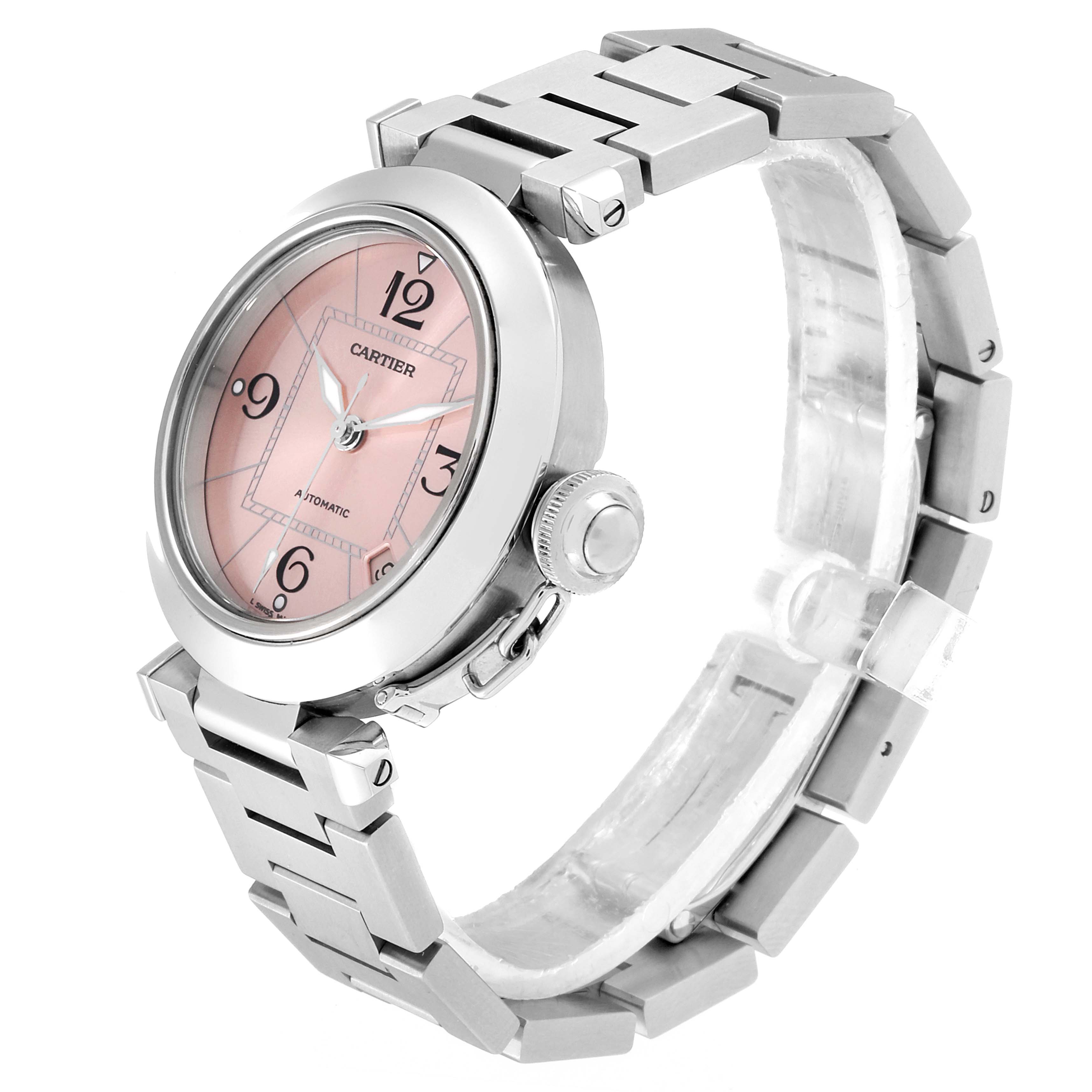 The Cartier Pasha W31075M7 Women's Stainless Steel Pink Dial W31075M7 Women's Stainless Steel Pink Dial watch is shown at a three-quarter angle, highlighting its pink dial, crown, and metal bracelet.