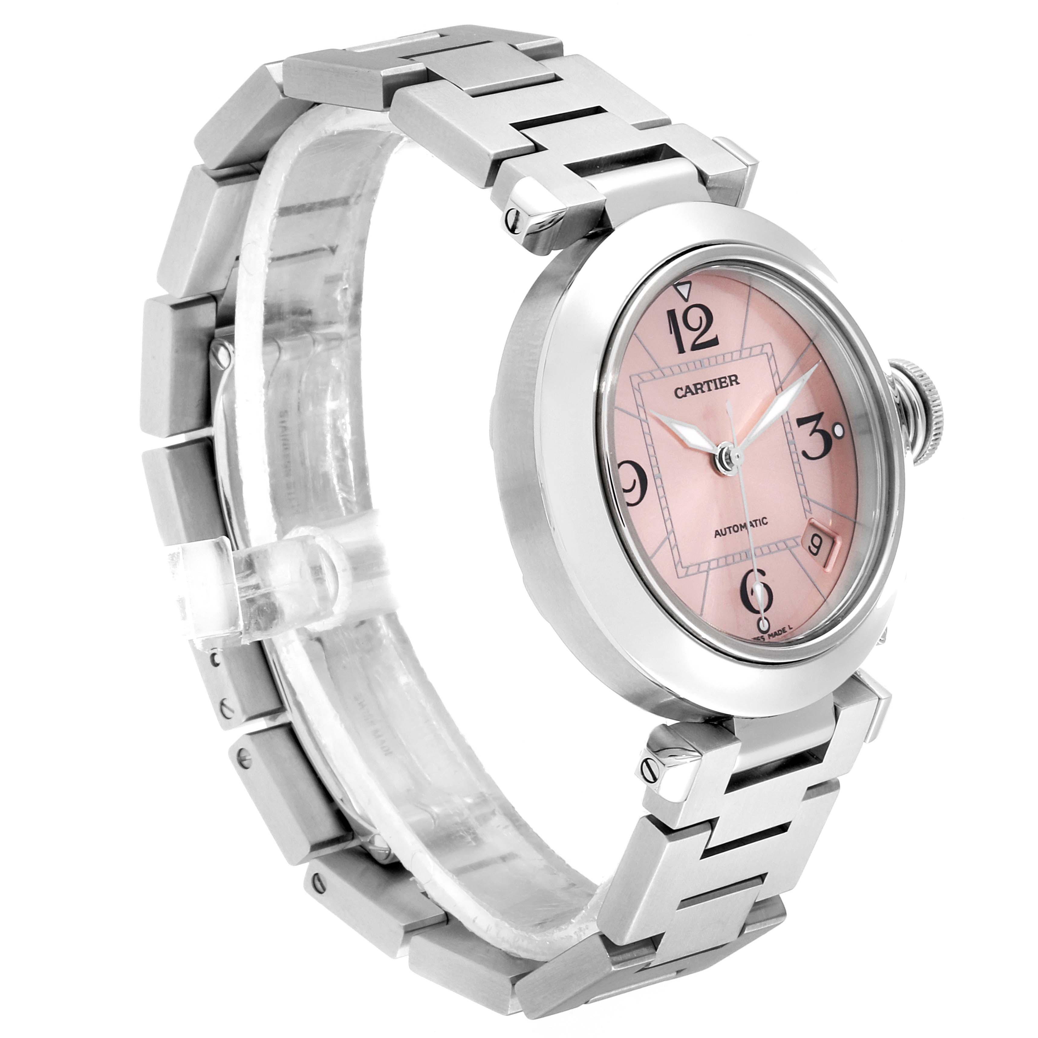 The image shows a side angle view of a pink-dial Cartier Pasha W31075M7 Women's Stainless Steel Pink Dial W31075M7 Women's Stainless Steel Pink Dial watch, highlighting its face and metal bracelet.