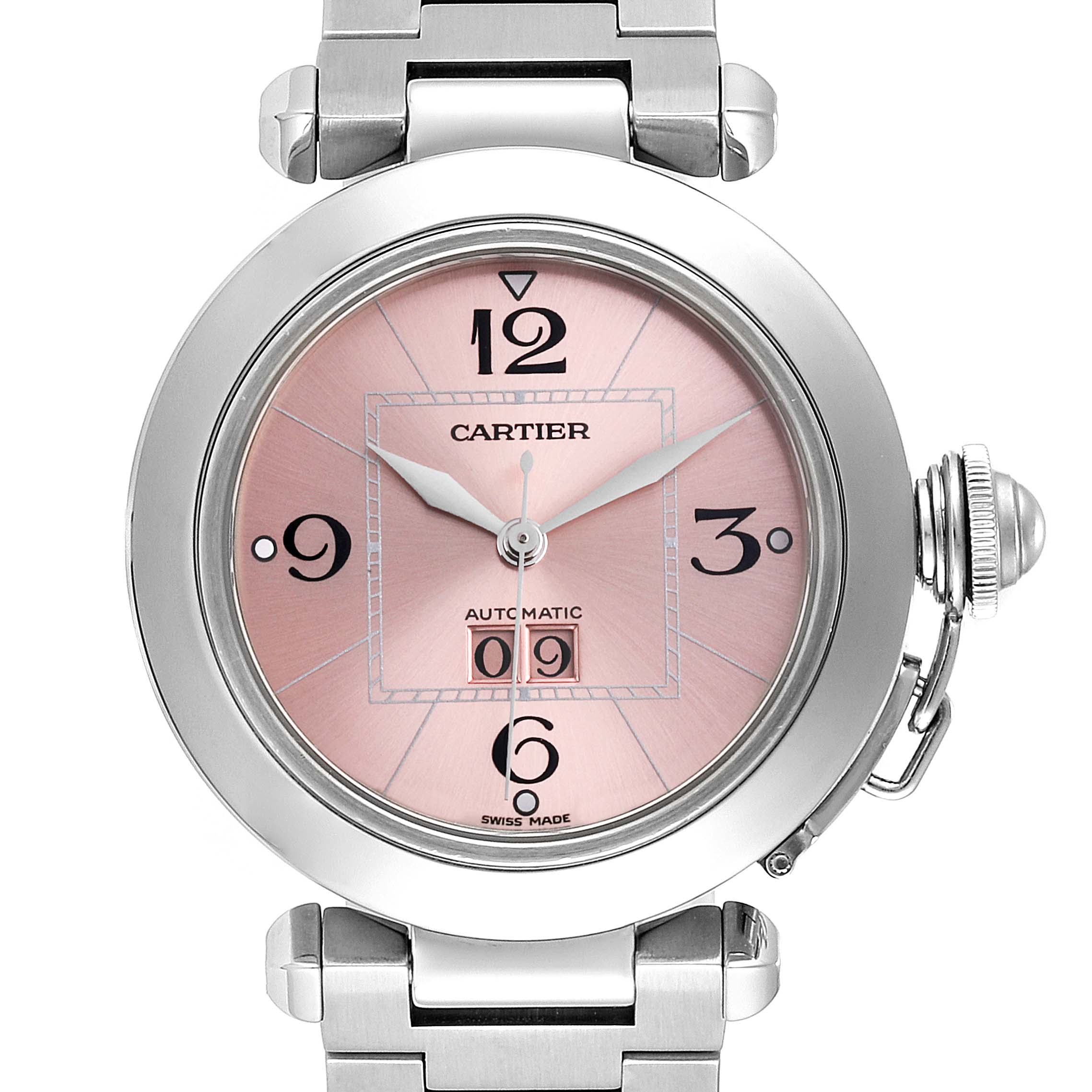 The Cartier Pasha W31058M7  Women's Stainless Steel Pink Dial W31058M7  Women's Stainless Steel Pink Dial watch is shown from the front, displaying its pink dial, numerals, hands, crown guard, and partial bracelet.