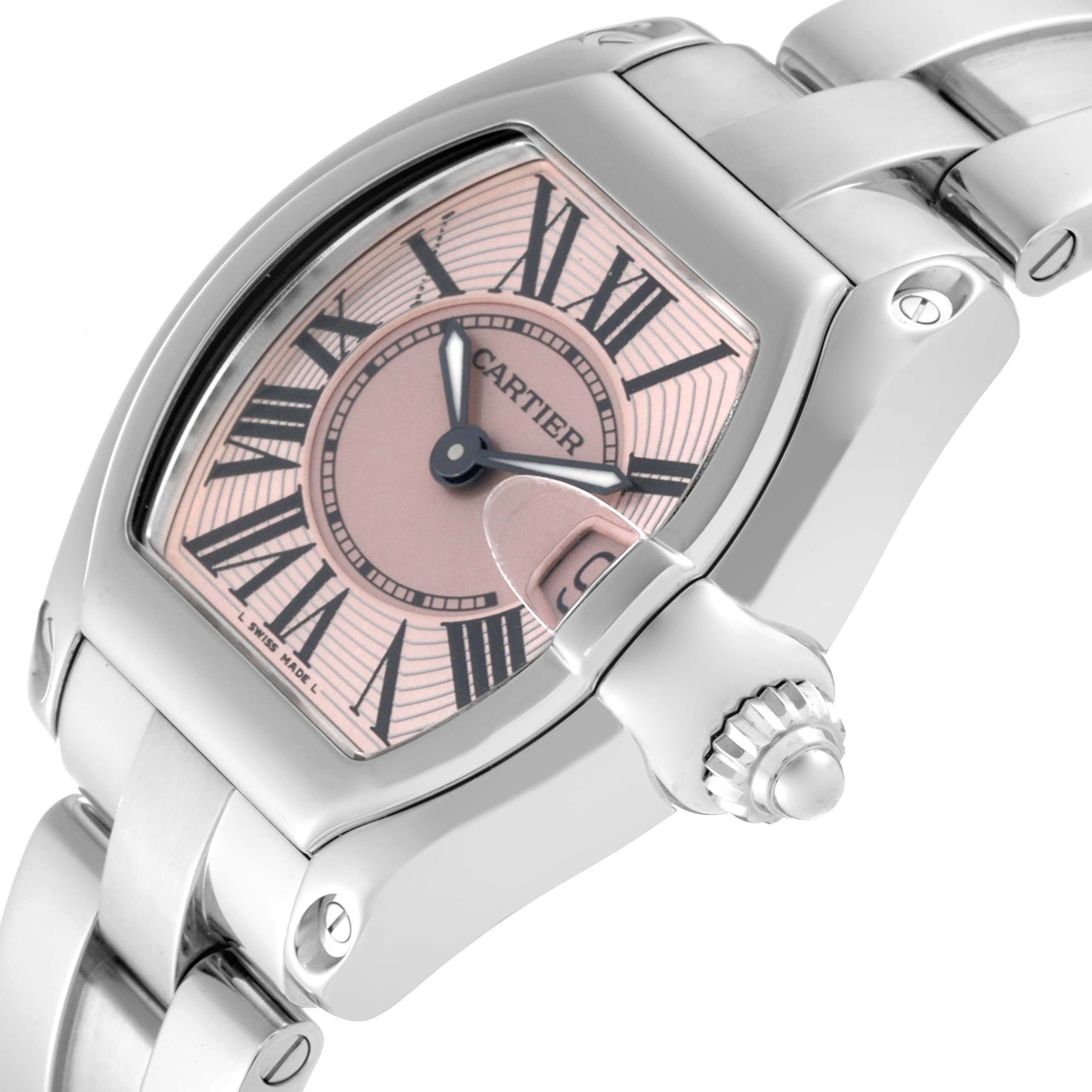 The image shows a close-up angle of a Cartier Roadster W62017V3 Women's Stainless Steel Pink Dial W62017V3 Women's Stainless Steel Pink Dial watch, highlighting its face, bezel, crown, and part of the bracelet.