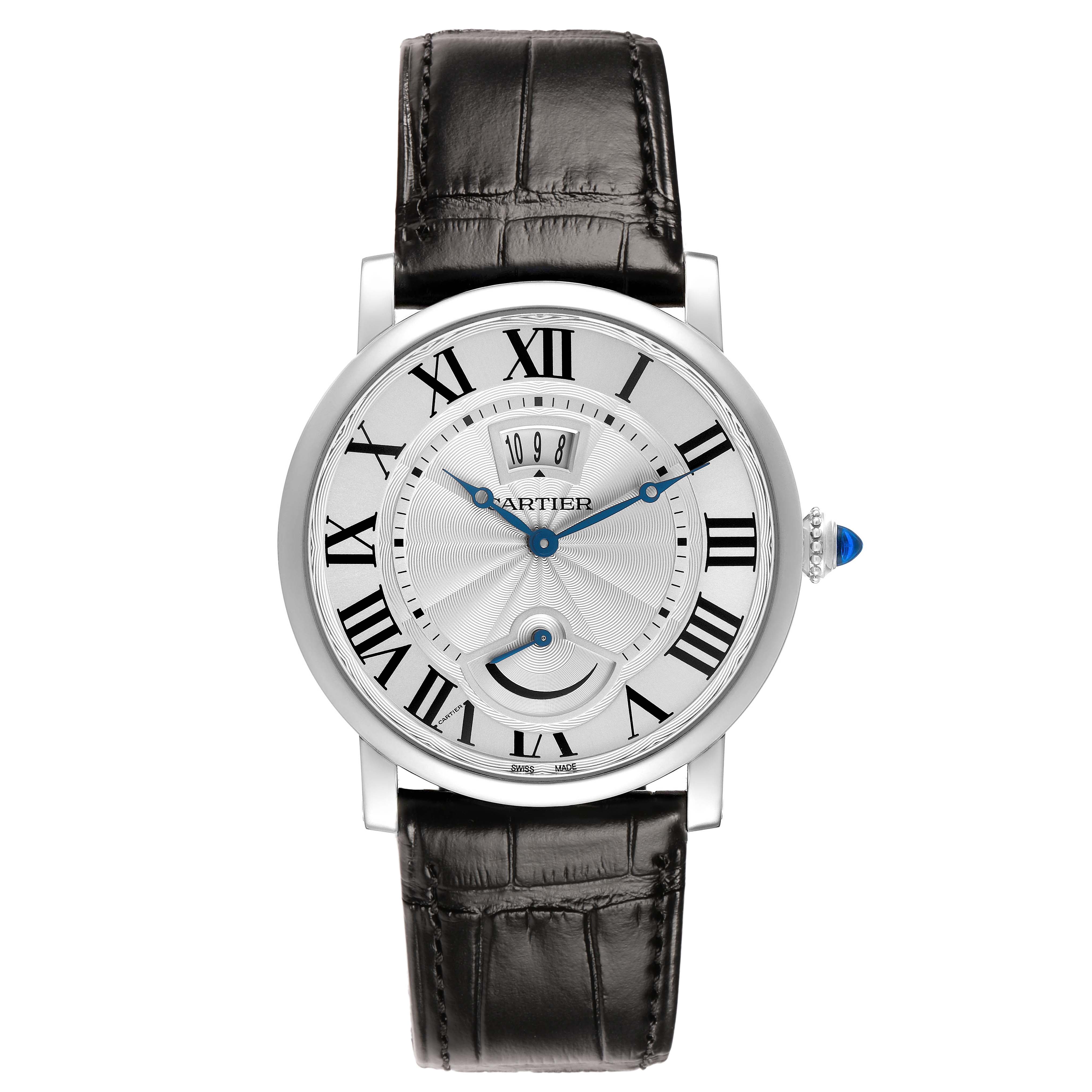 The Cartier Rotonde W1556369 Men's Stainless Steel Silver Dial watch is shown from the front, featuring its round face, Roman numerals, blued hands, and black leather strap.