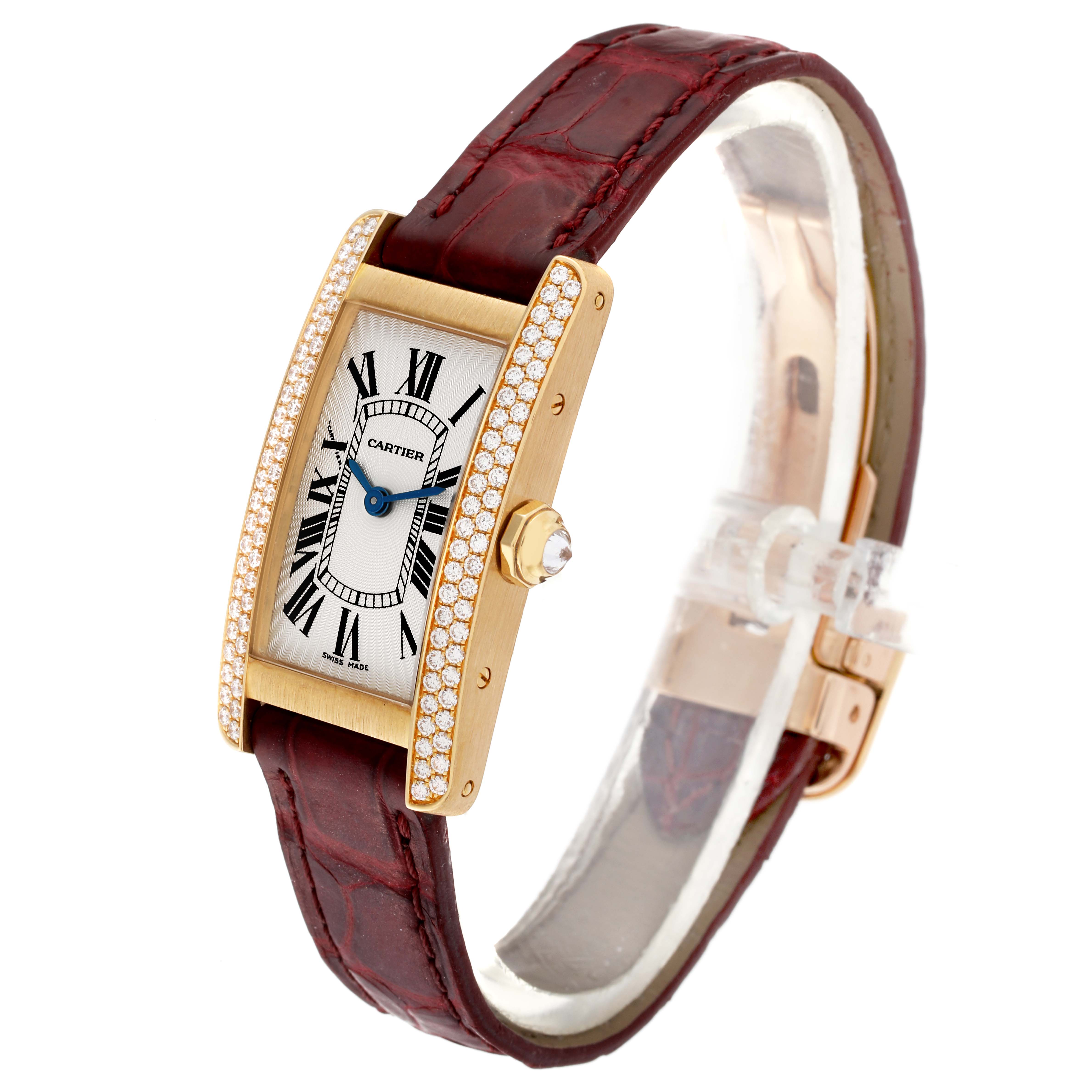 The image shows a Cartier Tank Americaine WB701251 Women's Yellow Gold Silver Dial WB701251 Women's Yellow Gold Silver Dial watch at an oblique angle, highlighting its face, crown, and leather strap.