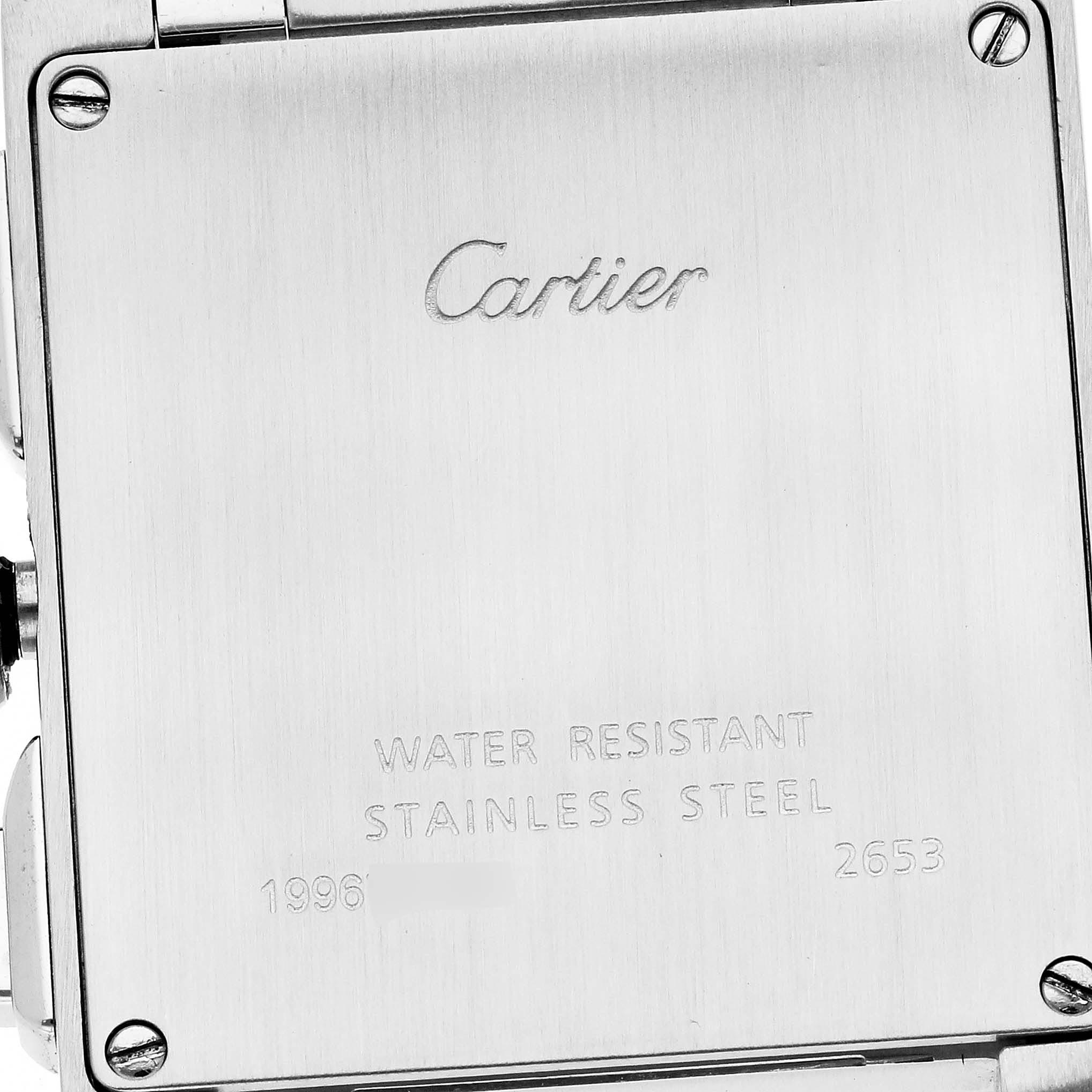 The image shows the back case of the Cartier Tank Française watch, highlighting the brand
s engraving and material details.