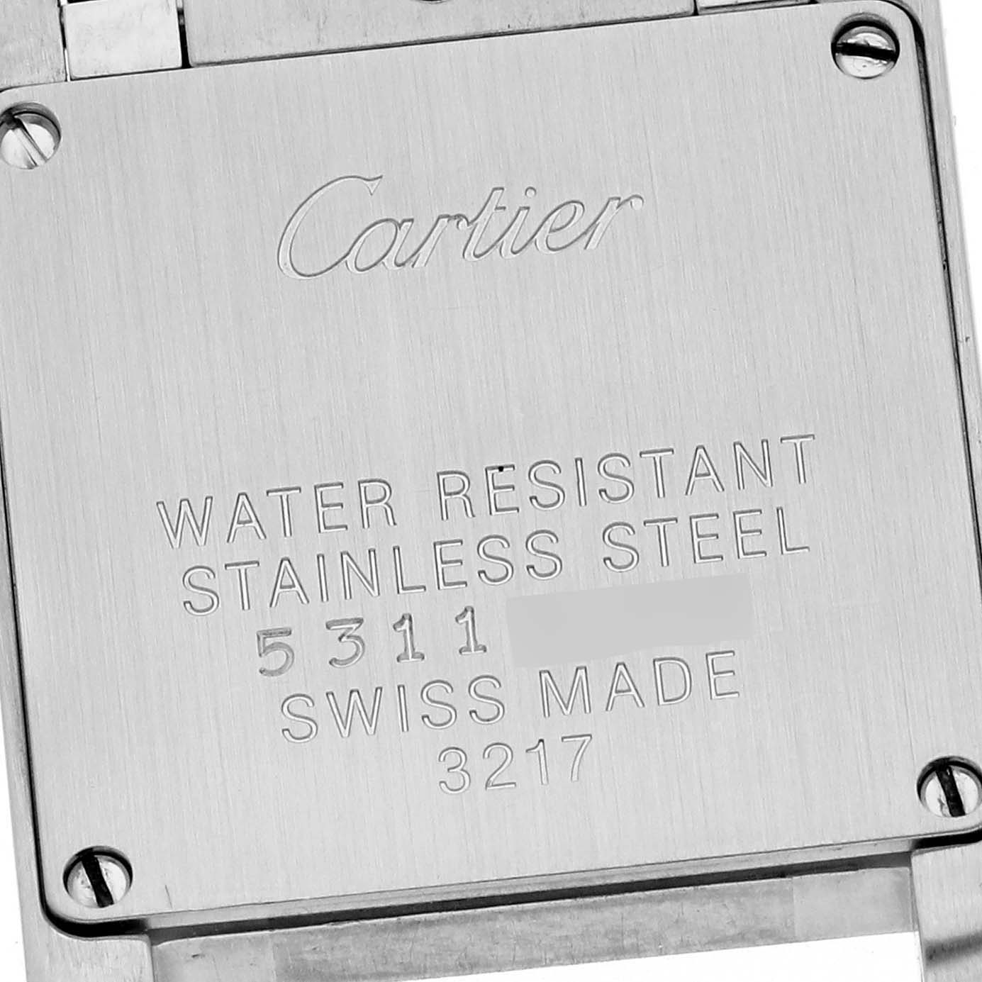 This image shows the engraved back plate of a Cartier Tank Francaise WE110004 Women's Steel and Gold (two tone) Silver Dial WE110004 Women's Steel and Gold (two tone) Silver Dial watch, indicating its water-resistant and stainless steel features.
