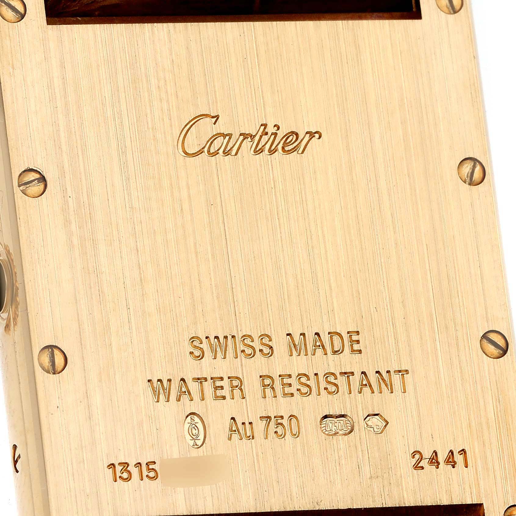 The image shows the back casing of a Cartier Tank Louis W1529756 Men's Yellow Gold Silver Dial W1529756 Men's Yellow Gold Silver Dial watch, highlighting engravings and screws.