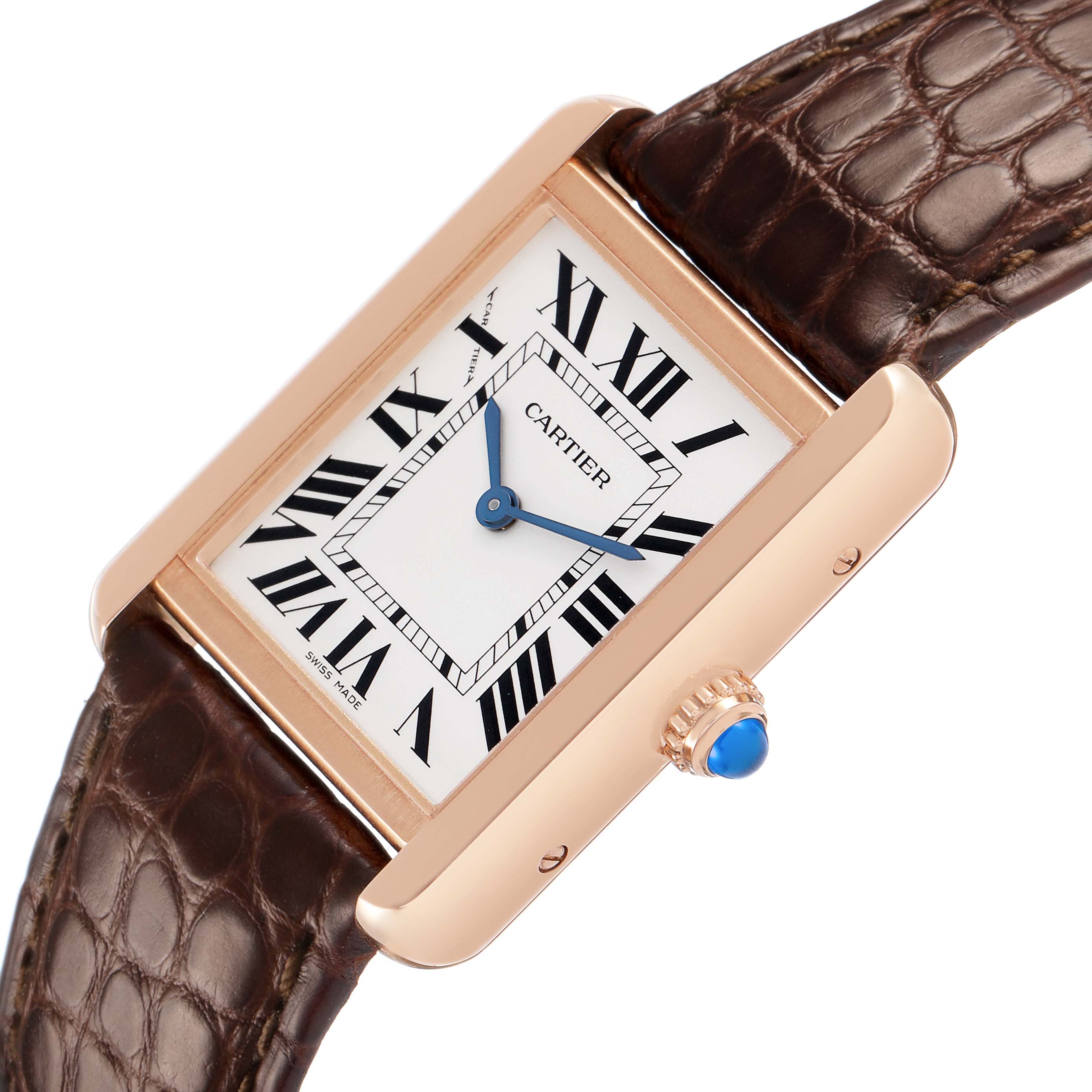The Cartier Tank Solo W5200024 Women's Rose Gold Silver Dial is viewed at an angle showing its rectangular face, Roman numerals, blued hands, and a crown with a blue cabochon.