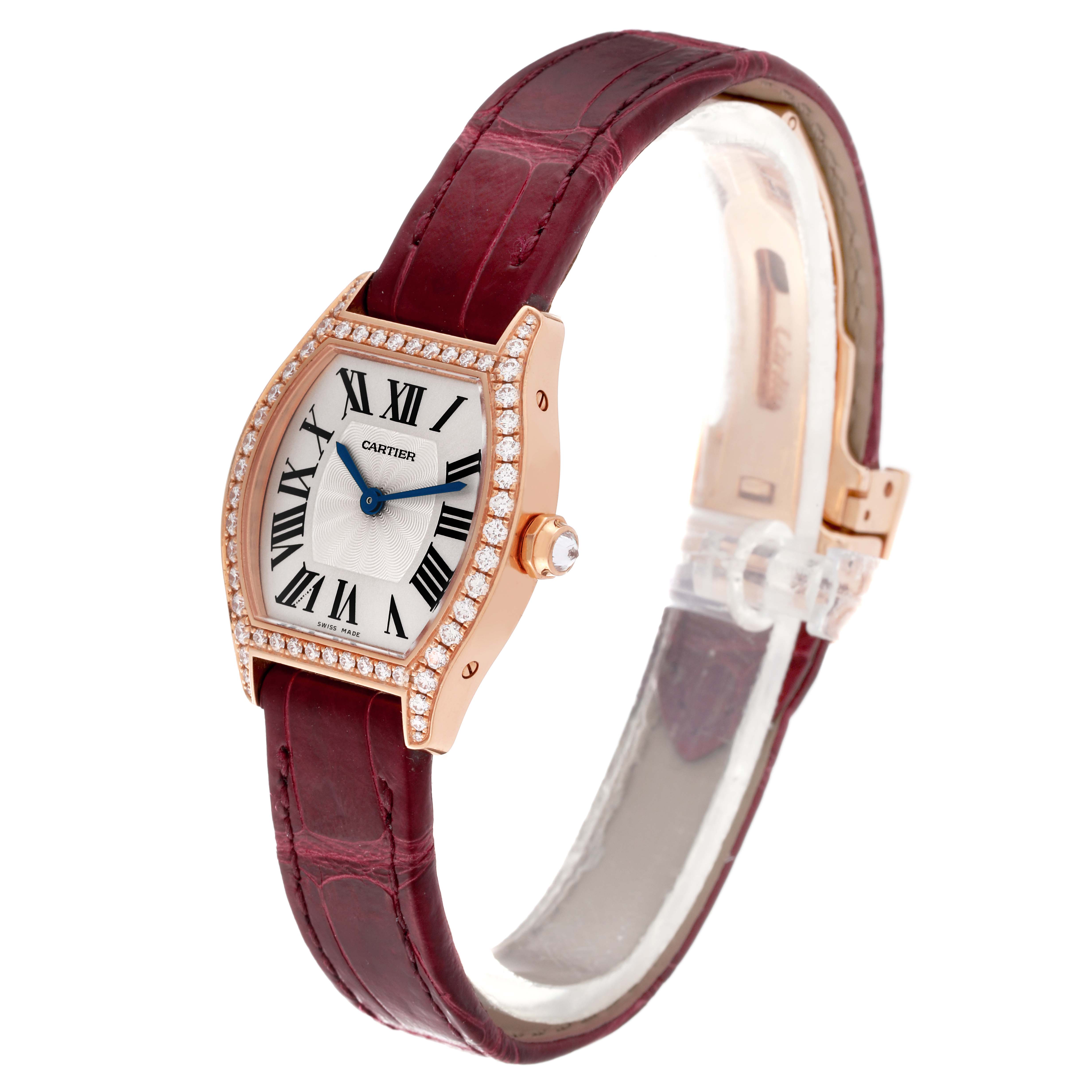 This image shows a Cartier Tortue WA501010 Women's Rose Gold Silver Dial WA501010 Women's Rose Gold Silver Dial watch at a slight angle, highlighting its burgundy strap, diamond bezel, and Roman numeral dial.