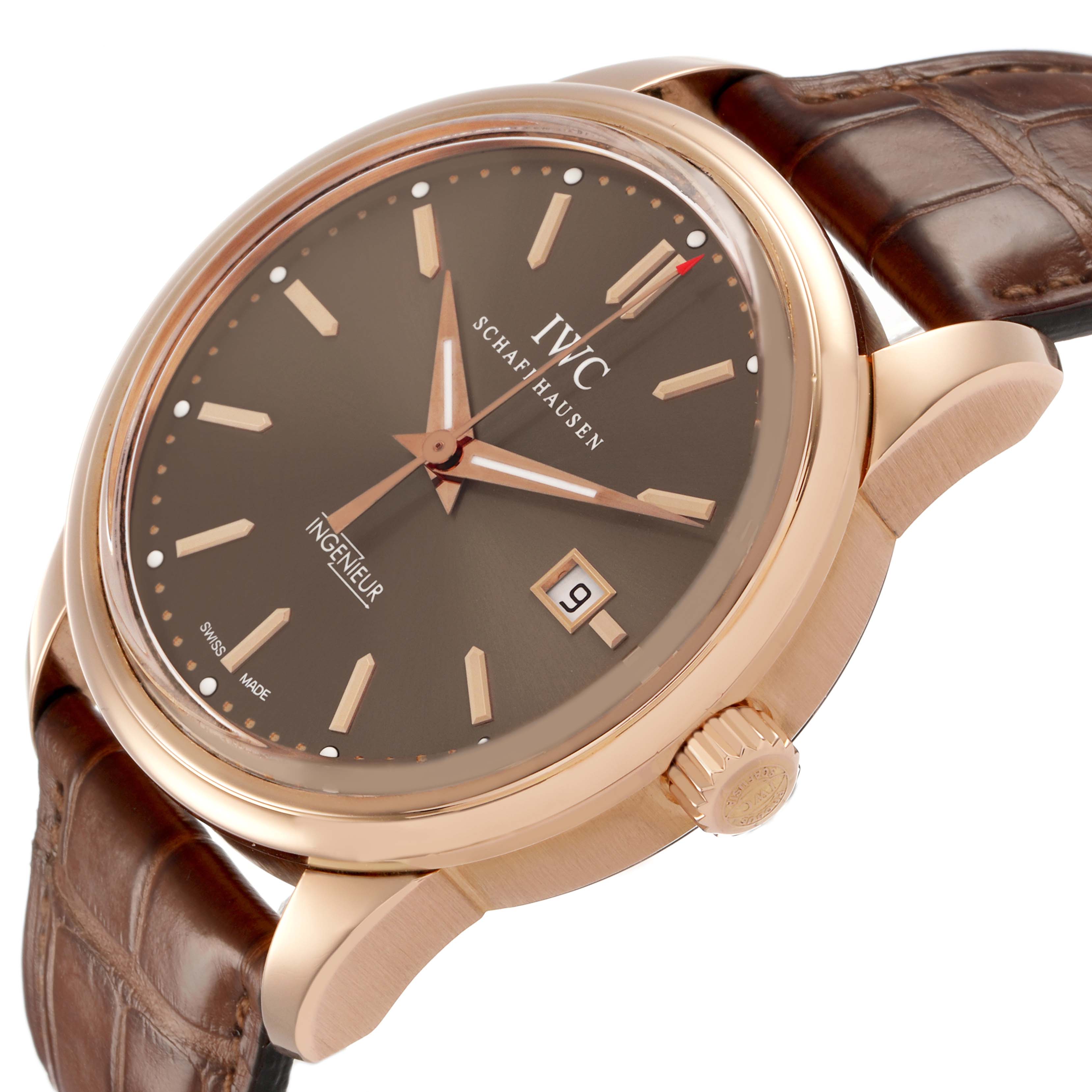 The IWC Ingenieur IW323312 Men's Rose Gold Brown Dial watch is shown at a side angle, highlighting the case, crown, dial, and brown leather strap.