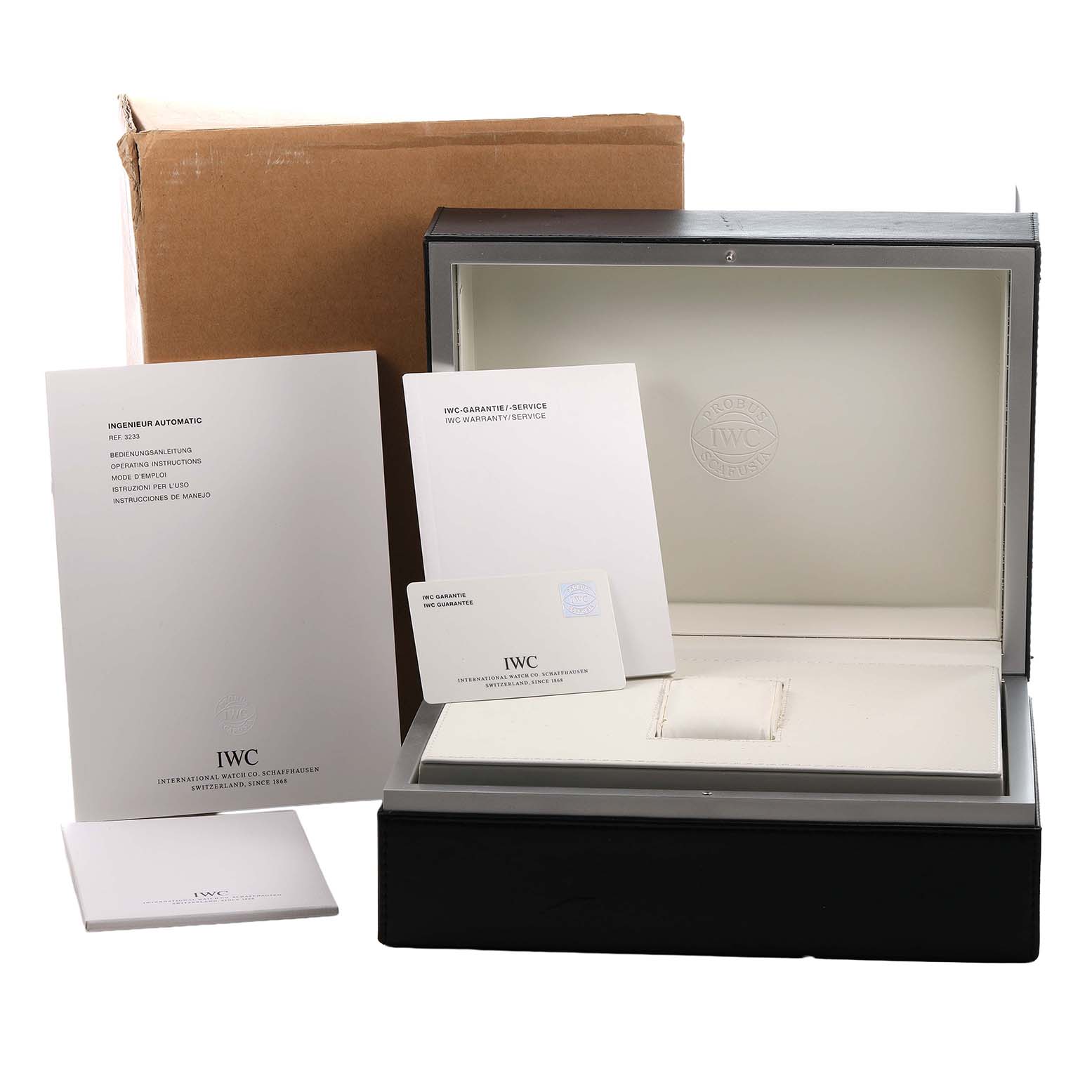The image shows the IWC Ingenieur IW323312 Men's Rose Gold Brown Dial watch box, warranty card, manual, and packaging materials.