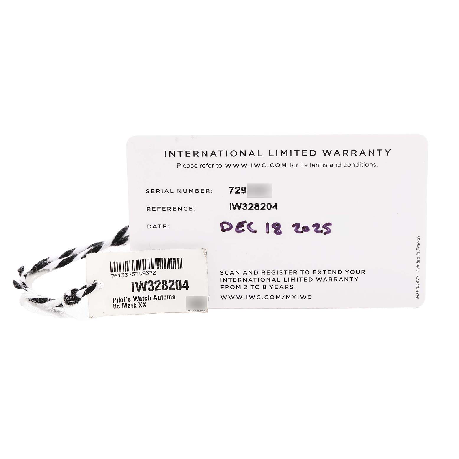 The image shows an IWC Pilot IW328204 Men's Stainless Steel Blue Dial model warranty card and a tag, highlighting the reference number IW328204.