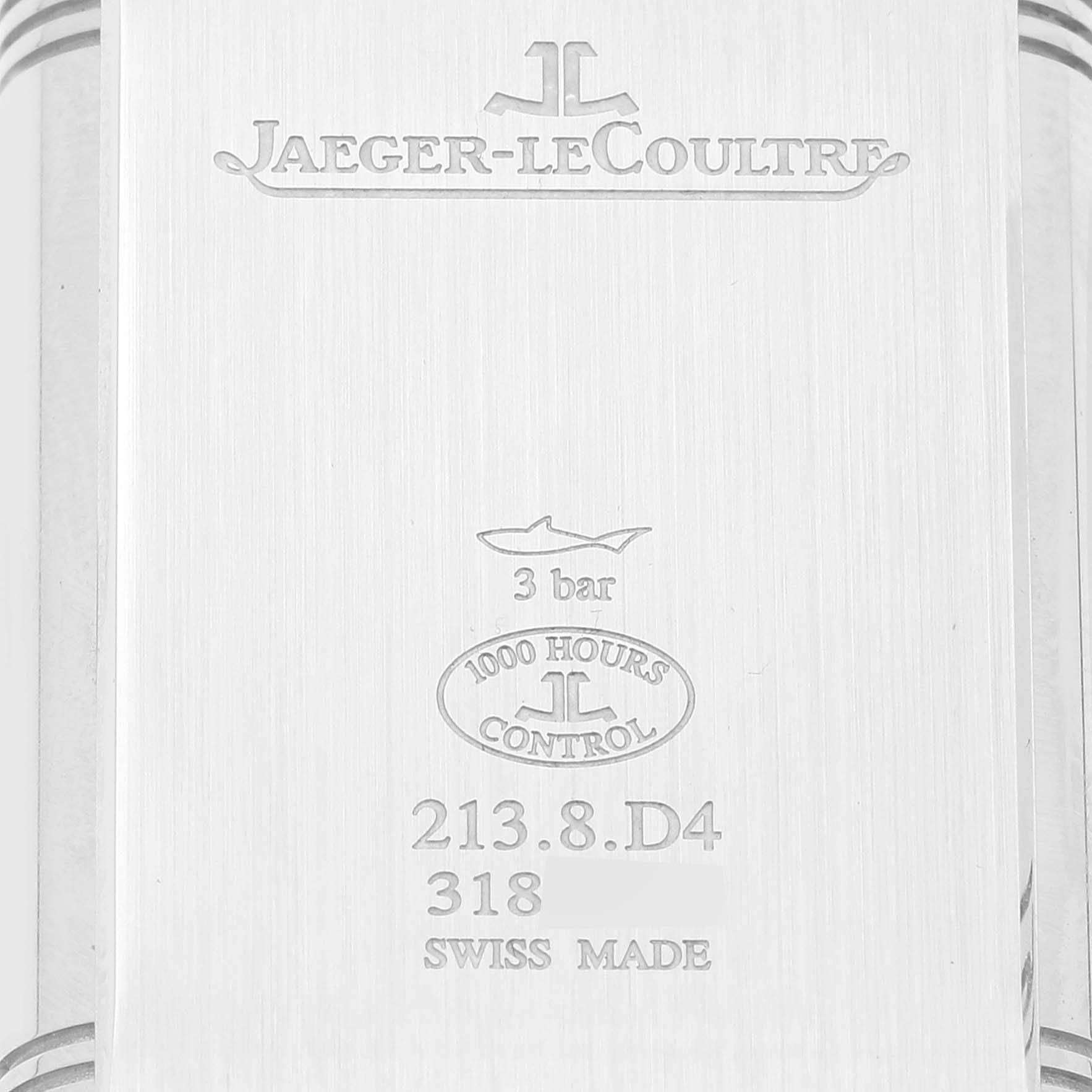 This image shows the back case of a Jaeger-LeCoultre Reverso watch, displaying brand and model information.