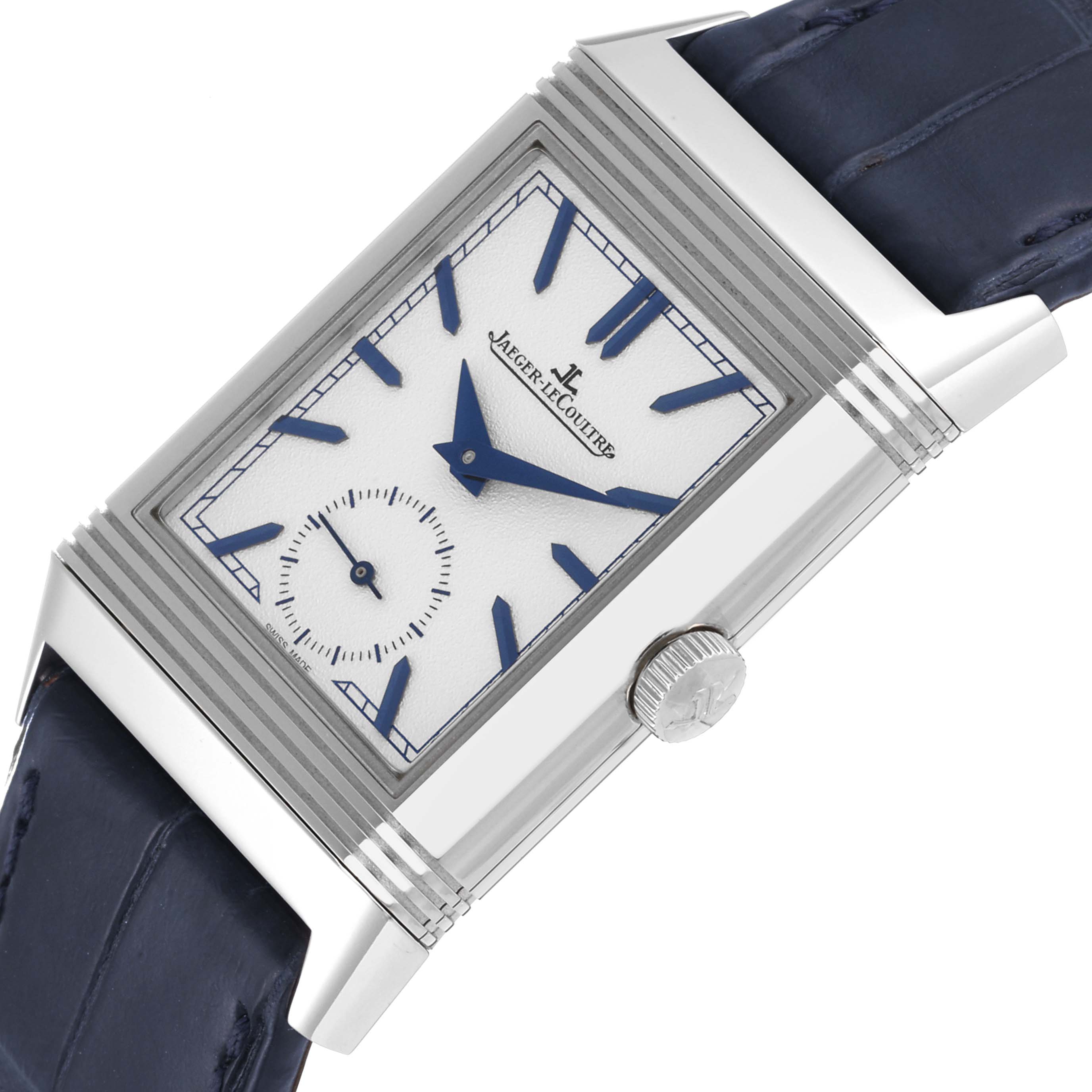 The image shows a close-up angle of a Jaeger-LeCoultre Reverso watch, highlighting its dial, crown, and strap.