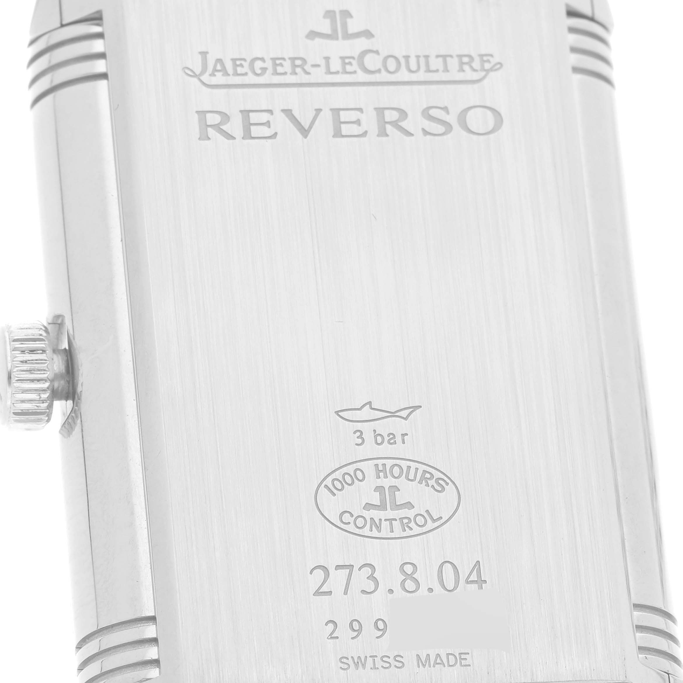 This image shows the back case of a Jaeger-LeCoultre Reverso watch, highlighting branding and specifications.