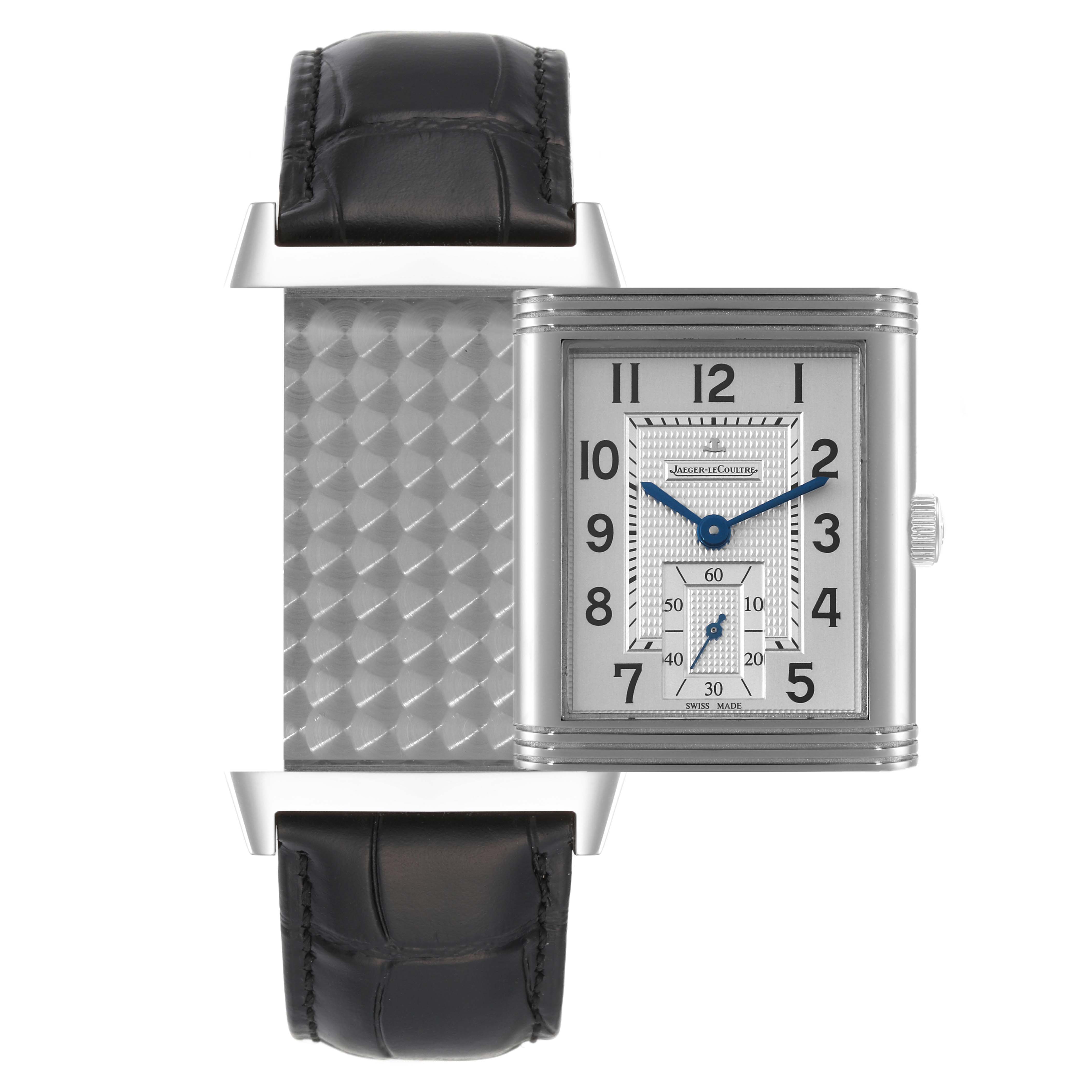 The image shows a Jaeger LeCoultre Reverso Q3738420 Men
s Stainless Steel Silver Dial Q3738420 Men
s Stainless Steel Silver Dial watch with its face and unique reversible case design partially opened, revealing the textured back.