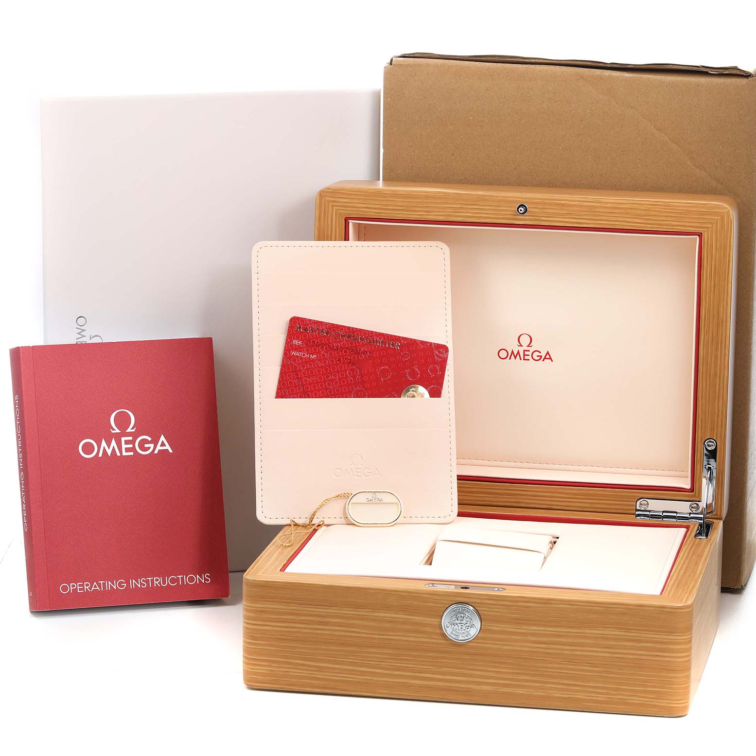 The image shows an Omega Seamaster 220.92.43.22.99.001 Men's Titanium Grey Dial model's presentation box, manual, warranty card, and storage case at eye level.