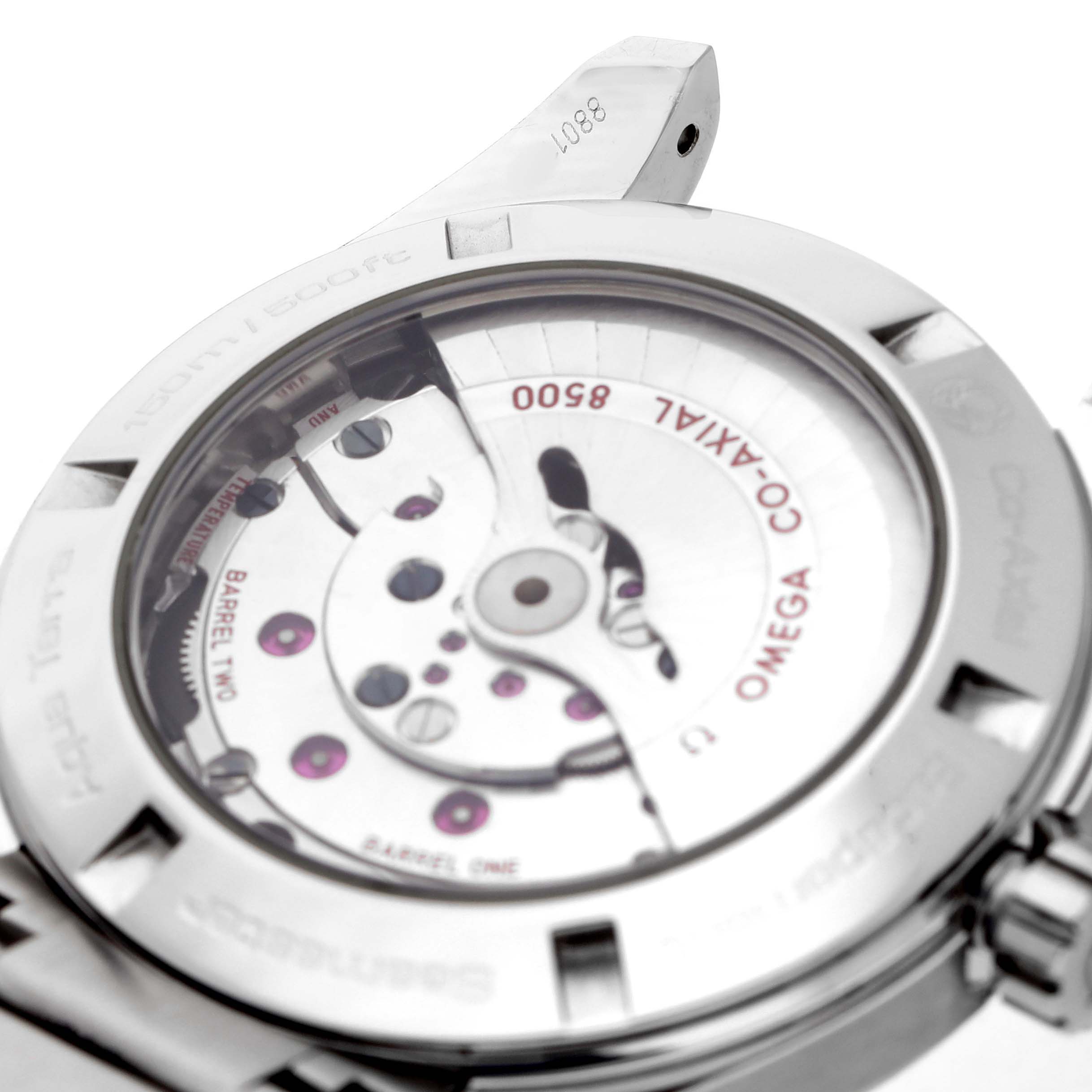 The image shows the back of an Omega Seamaster 231.10.42.21.03.001 Men's Stainless Steel Blue Dial watch, highlighting its movement and Co-Axial mechanism.
