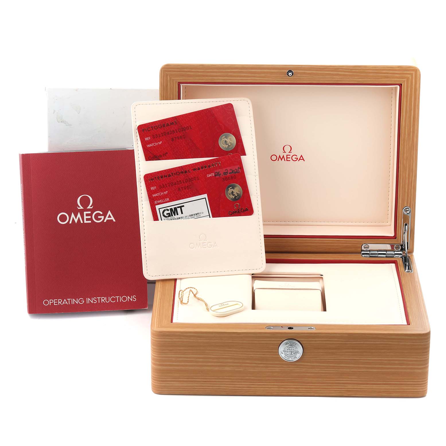 The image shows an Omega Speedmaster 331.20.42.51.02.001 Men
s Steel and Gold (two tone) Silver Dial 331.20.42.51.02.001 Men
s Steel and Gold (two tone) Silver Dial box, warranty cards, a holder, a booklet, and a tag, viewed from the top front angle.