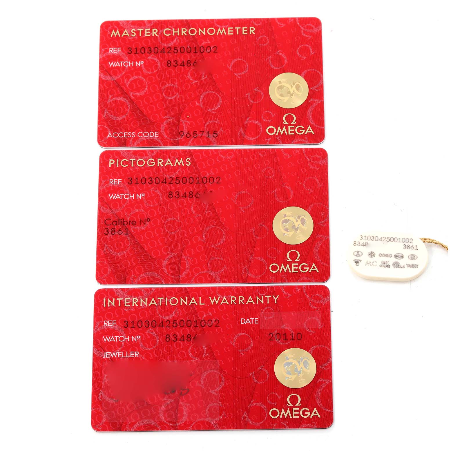 The image shows an Omega Speedmaster 310.30.42.50.01.002 Men
s Stainless Steel Black Dial 310.30.42.50.01.002 Men
s Stainless Steel Black Dial
s Master Chronometer, Pictograms, and International Warranty cards, along with a matching tag.