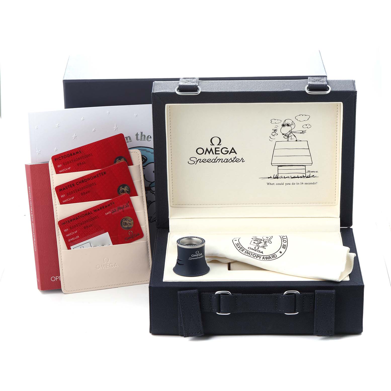 The Omega Speedmaster 310.32.42.50.02.001 Men's Stainless Steel Silver Dial 310.32.42.50.02.001 Men's Stainless Steel Silver Dial accessories are shown in an open box, featuring documentation, a cloth, and a magnifying glass.