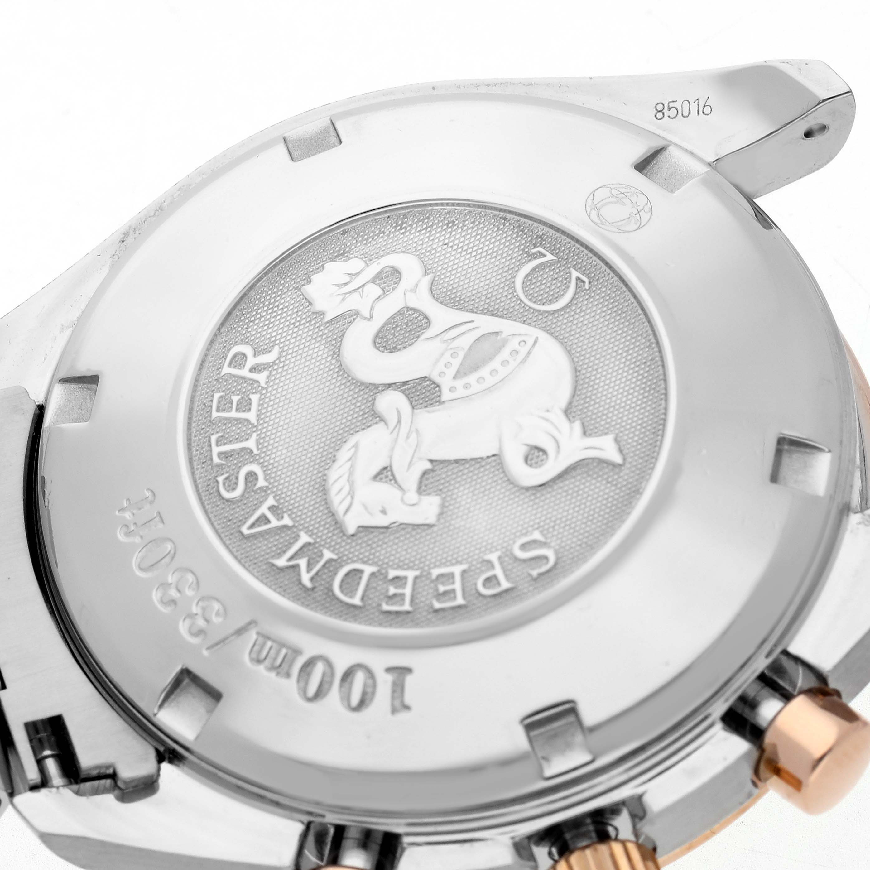 The image shows the back of an Omega Speedmaster 323.21.40.40.01.001 Men
s Steel and Gold (two tone) Black Dial 323.21.40.40.01.001 Men
s Steel and Gold (two tone) Black Dial watch, highlighting its engraved case back.