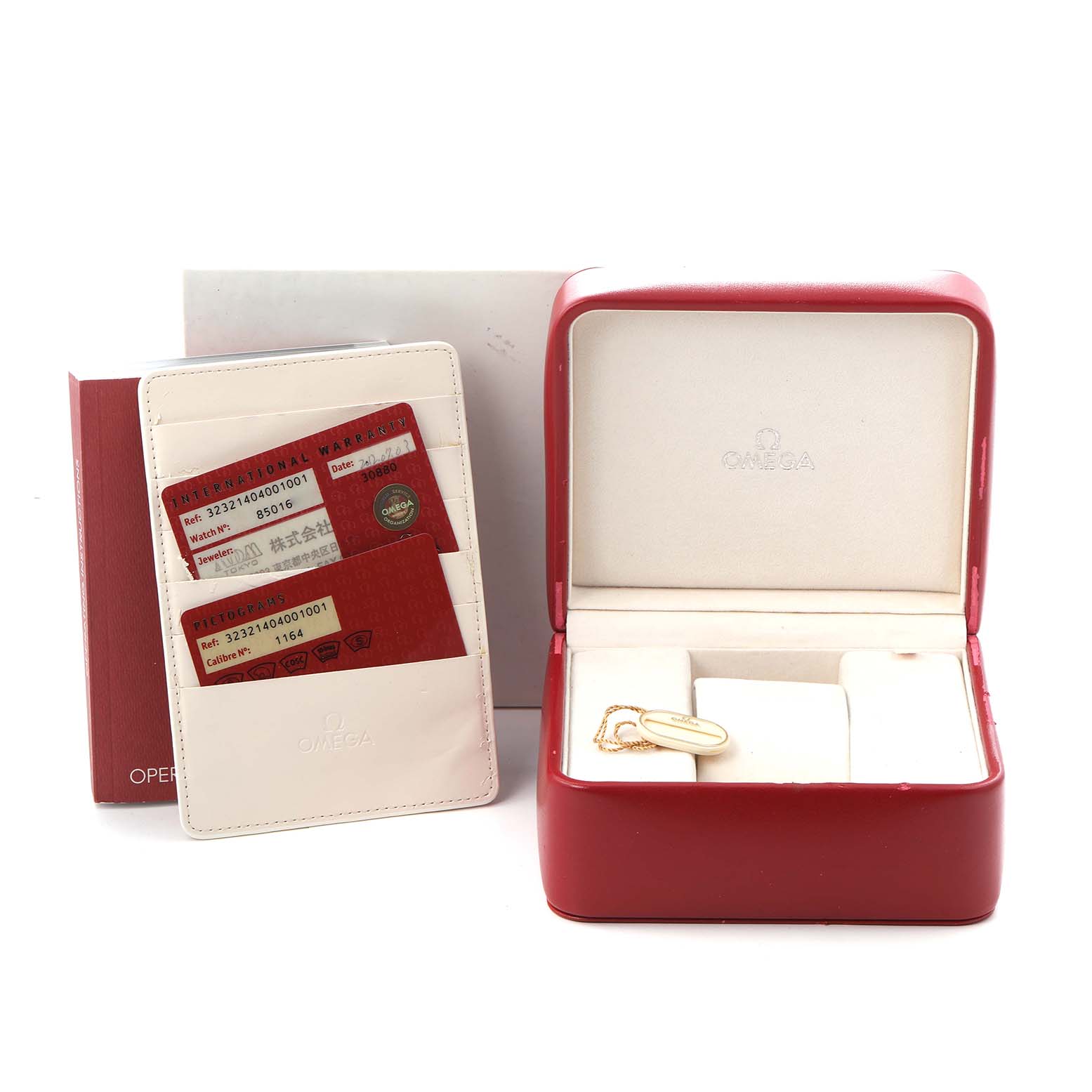 The image shows an Omega Speedmaster 323.21.40.40.01.001 Men
s Steel and Gold (two tone) Black Dial 323.21.40.40.01.001 Men
s Steel and Gold (two tone) Black Dial red watch box, warranty cards, and a cardholder from a slightly elevated angle.