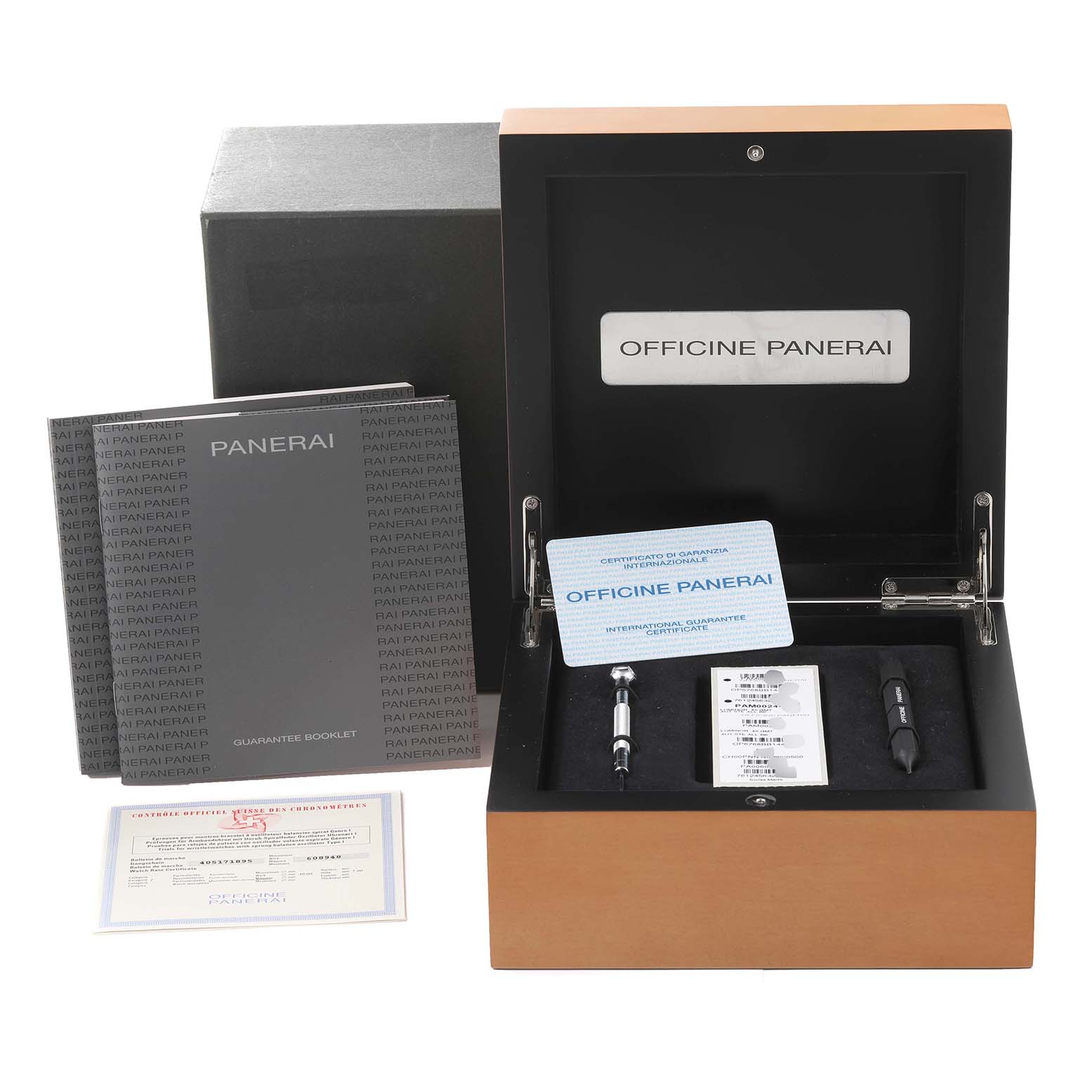 This image shows the packaging and accessories for a Panerai Luminor PAM00244 Men
s Stainless Steel Black Dial PAM00244 Men
s Stainless Steel Black Dial watch, including a presentation box, tools, and booklets.