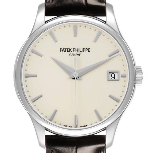 The Patek Philippe Calatrava 5227G-001 Men's White Gold Beige Dial watch is shown from the front, detailing its dial, hands, markers, and date window.