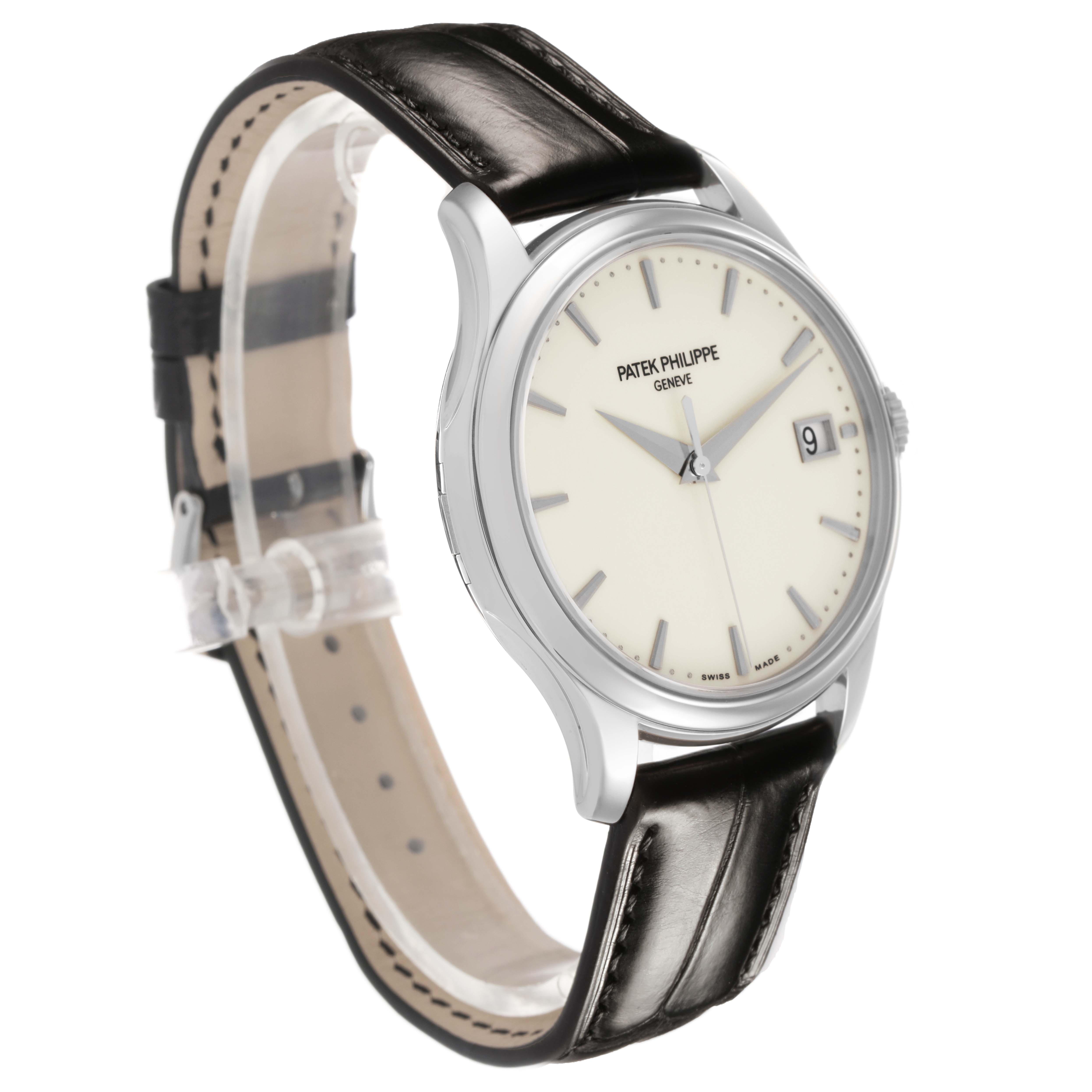 The Patek Philippe Calatrava 5227G-001 Men's White Gold Beige Dial watch is shown at a three-quarter angle, displaying the face, case, crown, and leather strap.