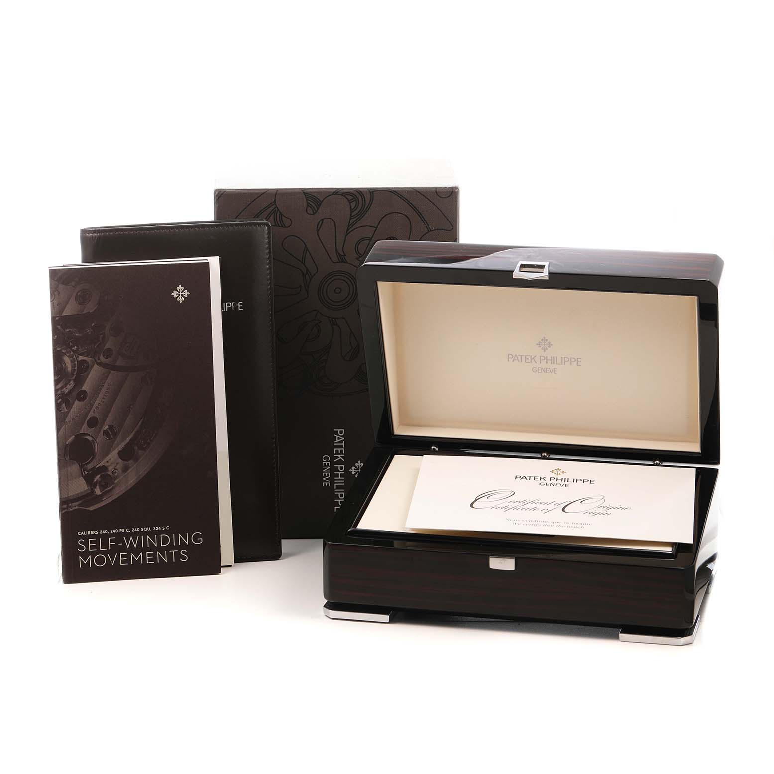 The image shows a Patek Philippe Calatrava 5227G-001 Men's White Gold Beige Dial watch box, open with certificates, accompanied by manuals and packaging.