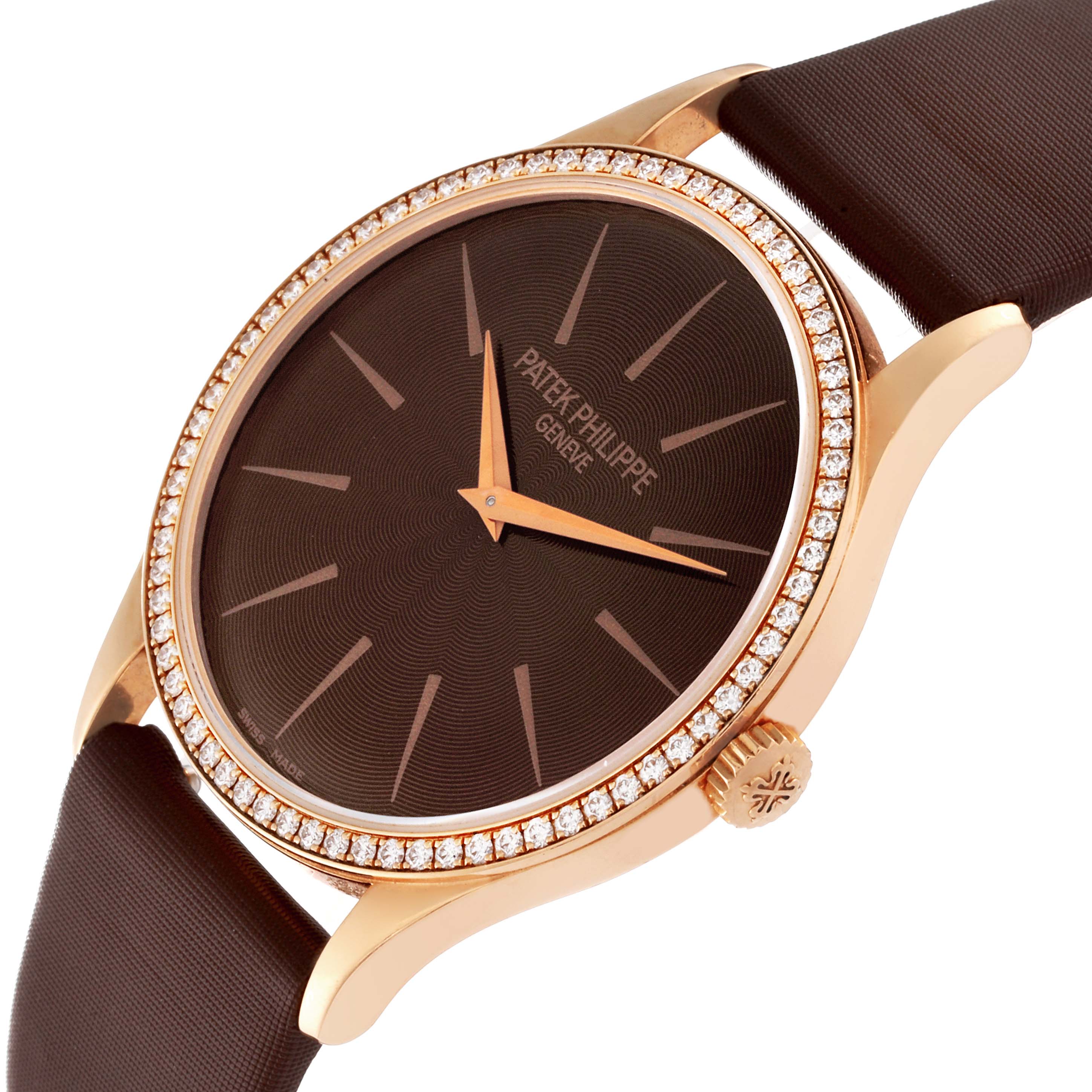 The image shows a Patek Philippe Calatrava 4897R-001 Women's Rose Gold Brown Dial 4897R-001 Women's Rose Gold Brown Dial watch at an angled close-up, highlighting the dial, diamond bezel, and crown.