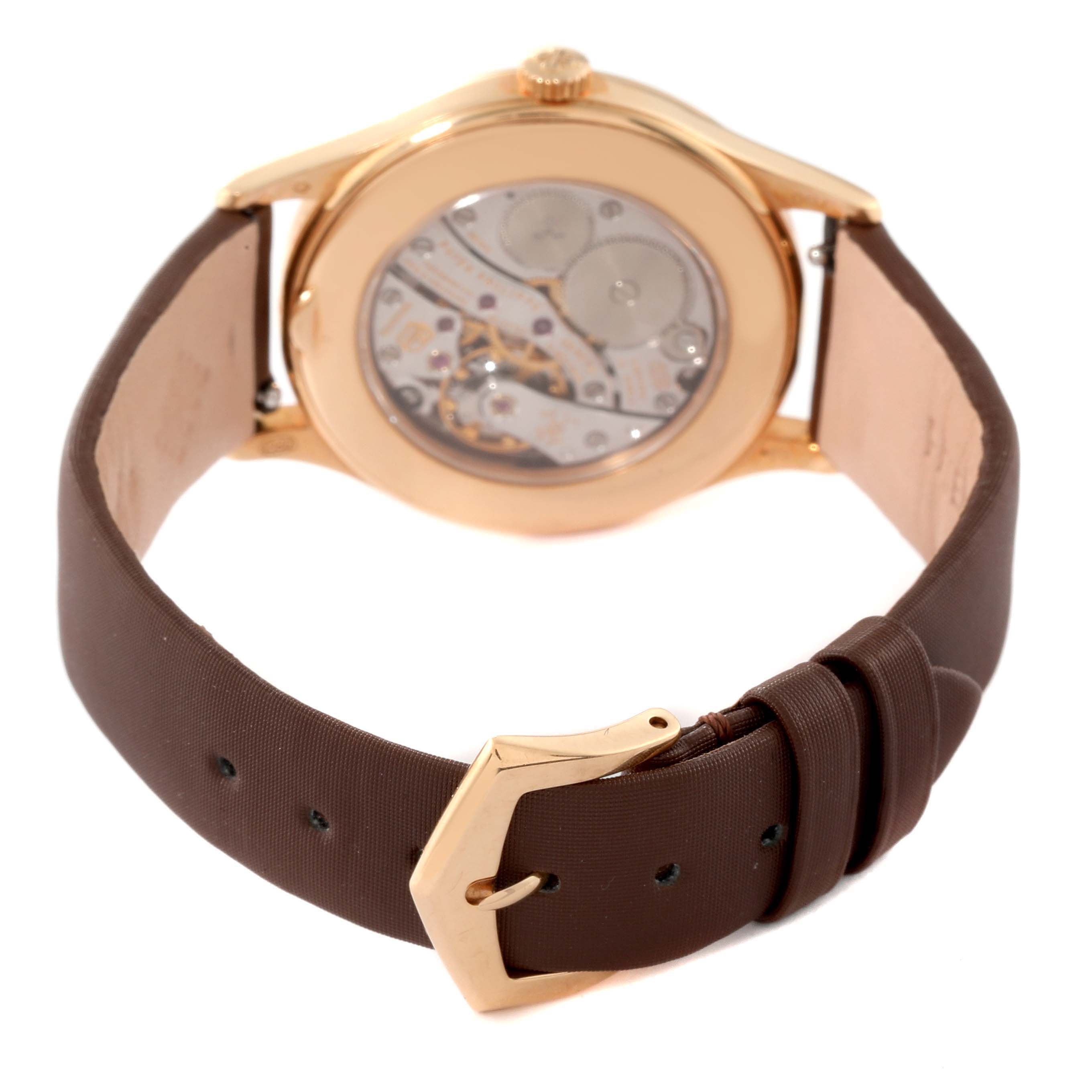 The image showcases the back view and strap of a Patek Philippe Calatrava 4897R-001 Women's Rose Gold Brown Dial 4897R-001 Women's Rose Gold Brown Dial watch, revealing the watch's mechanical movement.