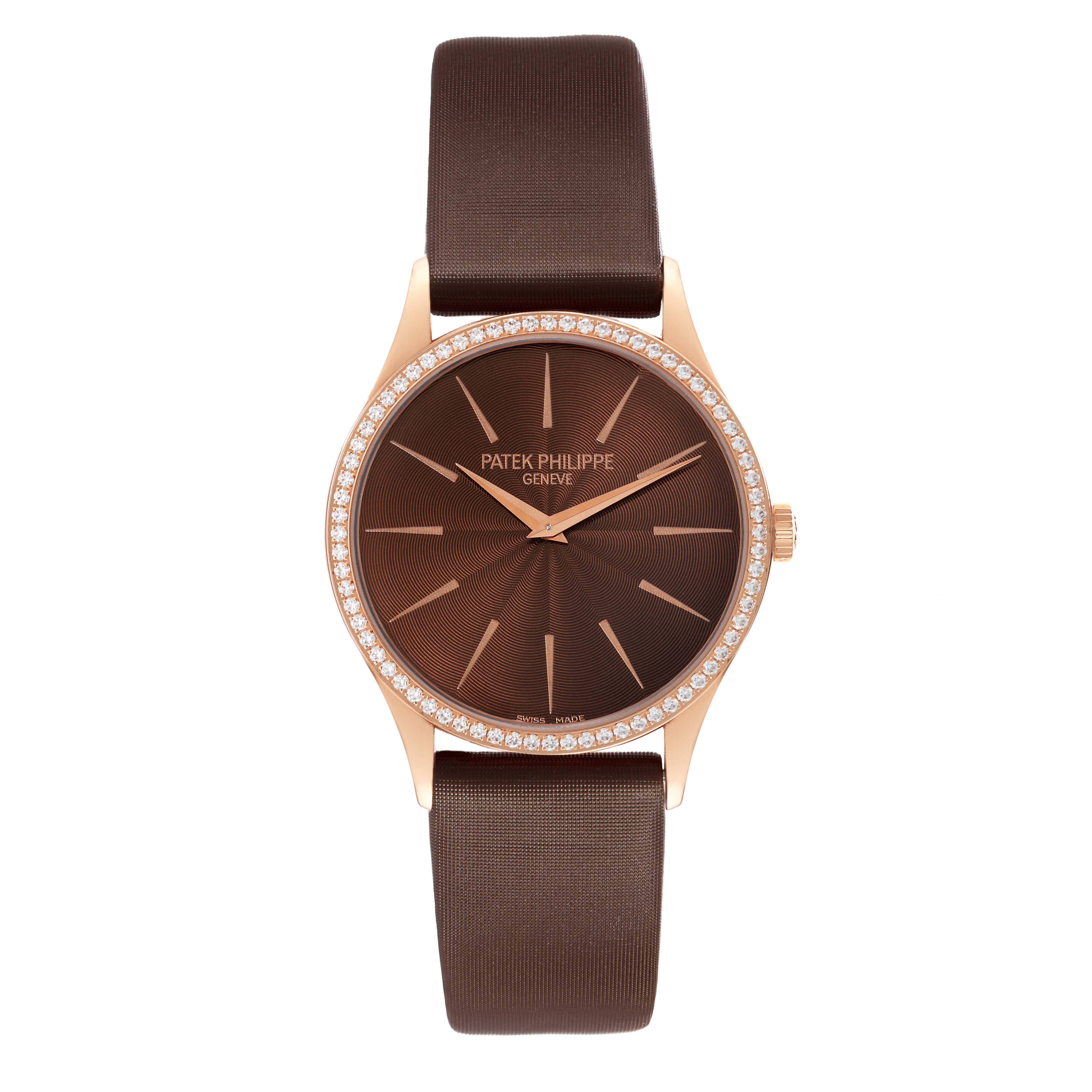 The Patek Philippe Calatrava 4897R-001 Women's Rose Gold Brown Dial watch is shown from the front, displaying its face, bezel with diamonds, and brown strap.