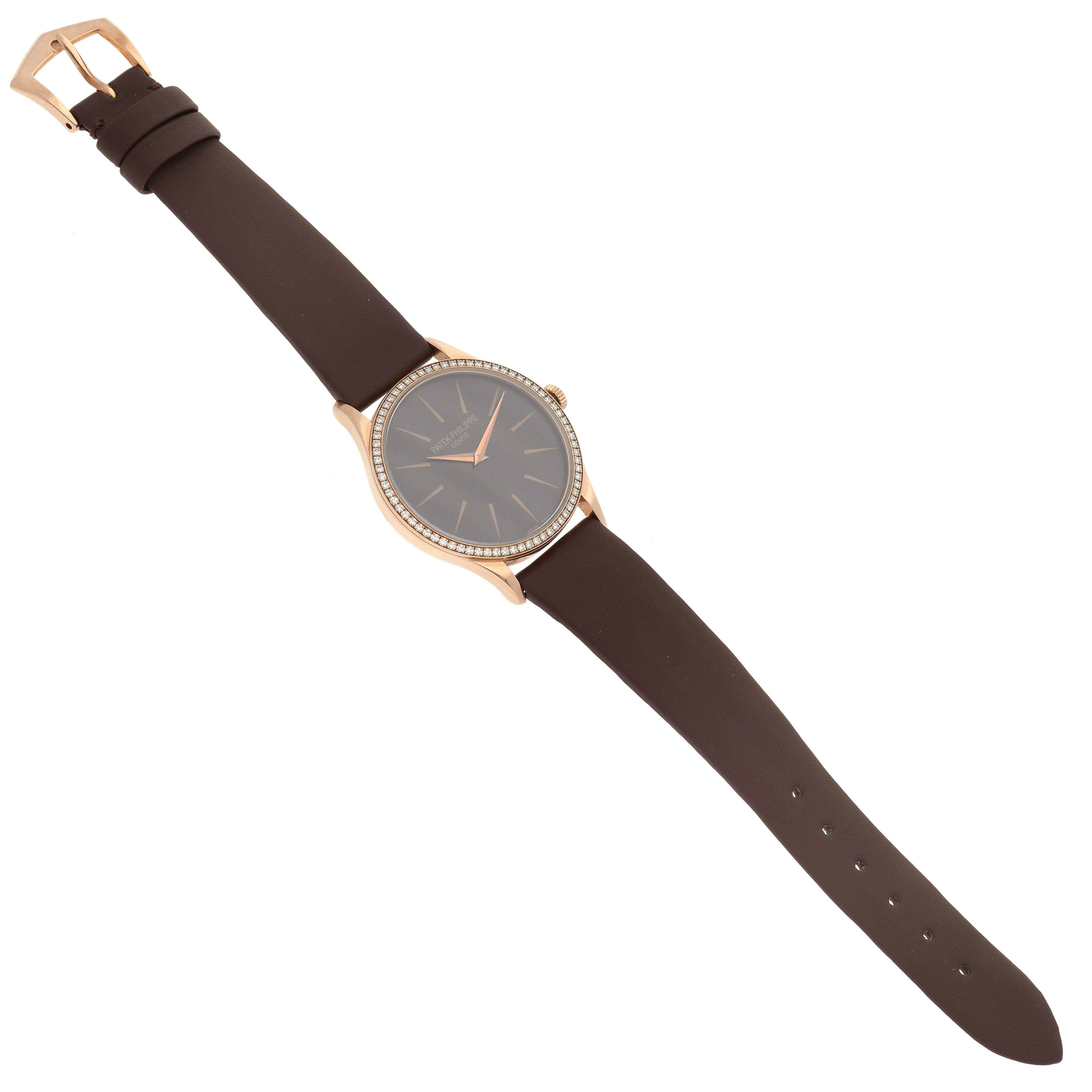 The Patek Philippe Calatrava 4897R-001 Women's Rose Gold Brown Dial is shown from an angled top-down view, displaying the watch face, case, and full strap.