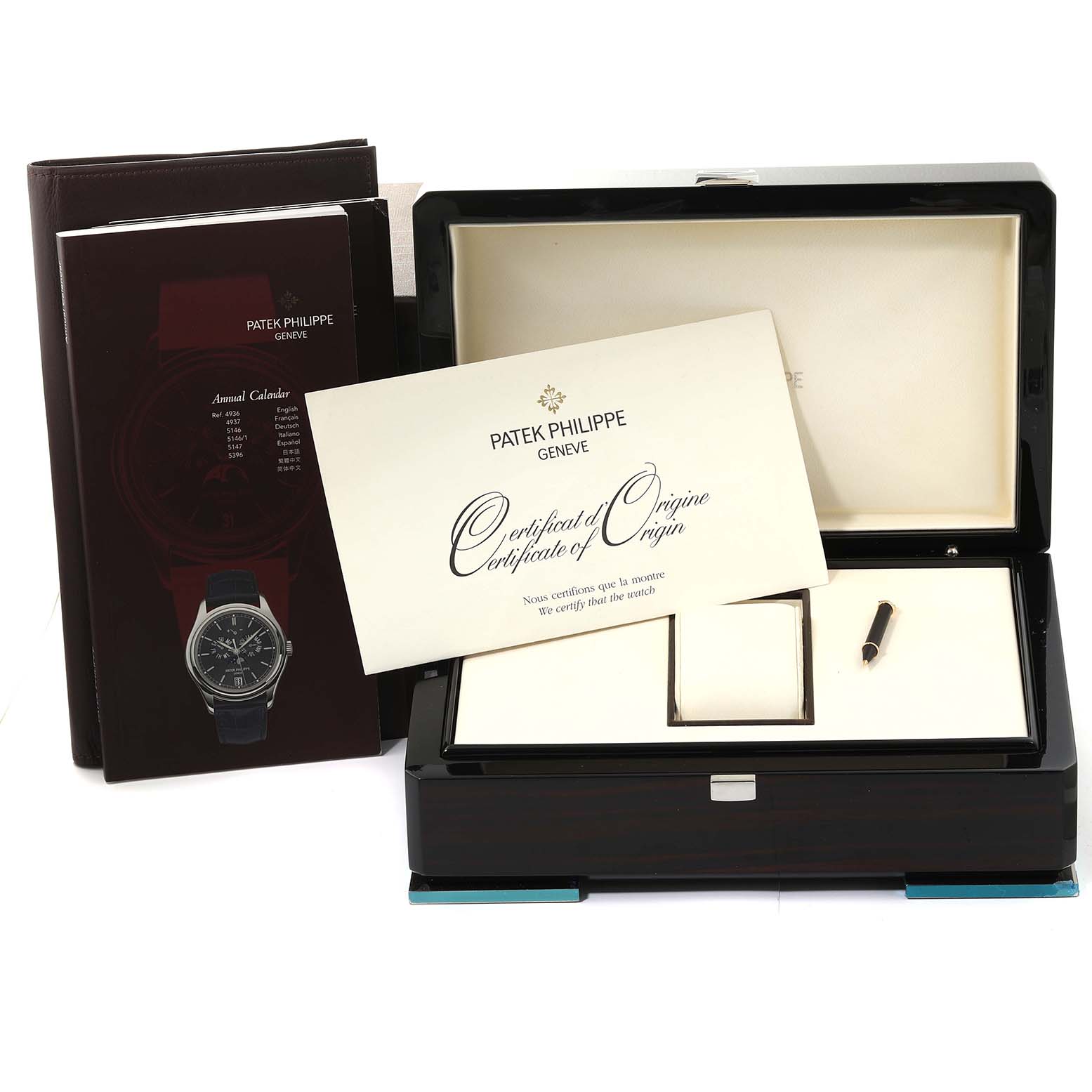 The image shows a Patek Philippe Complications 5146J Men's Yellow Gold White Dial 5146J Men's Yellow Gold White Dial watch box, certificate of origin, and a manual.